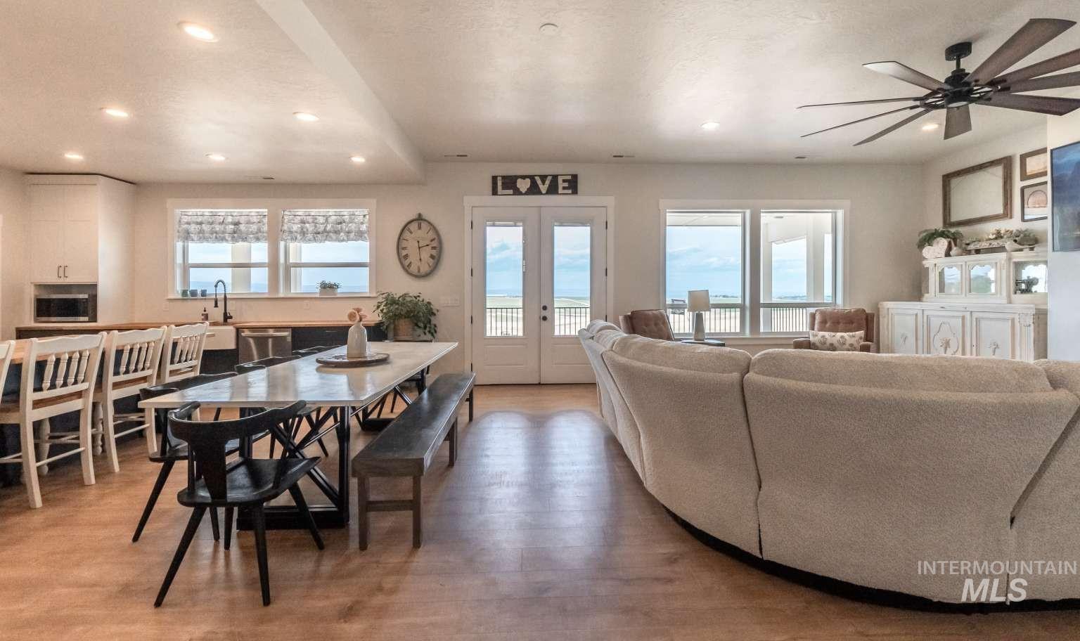 Dining room featuring recessed lighting, light wood-type flooring, french doors, and a ceiling fan