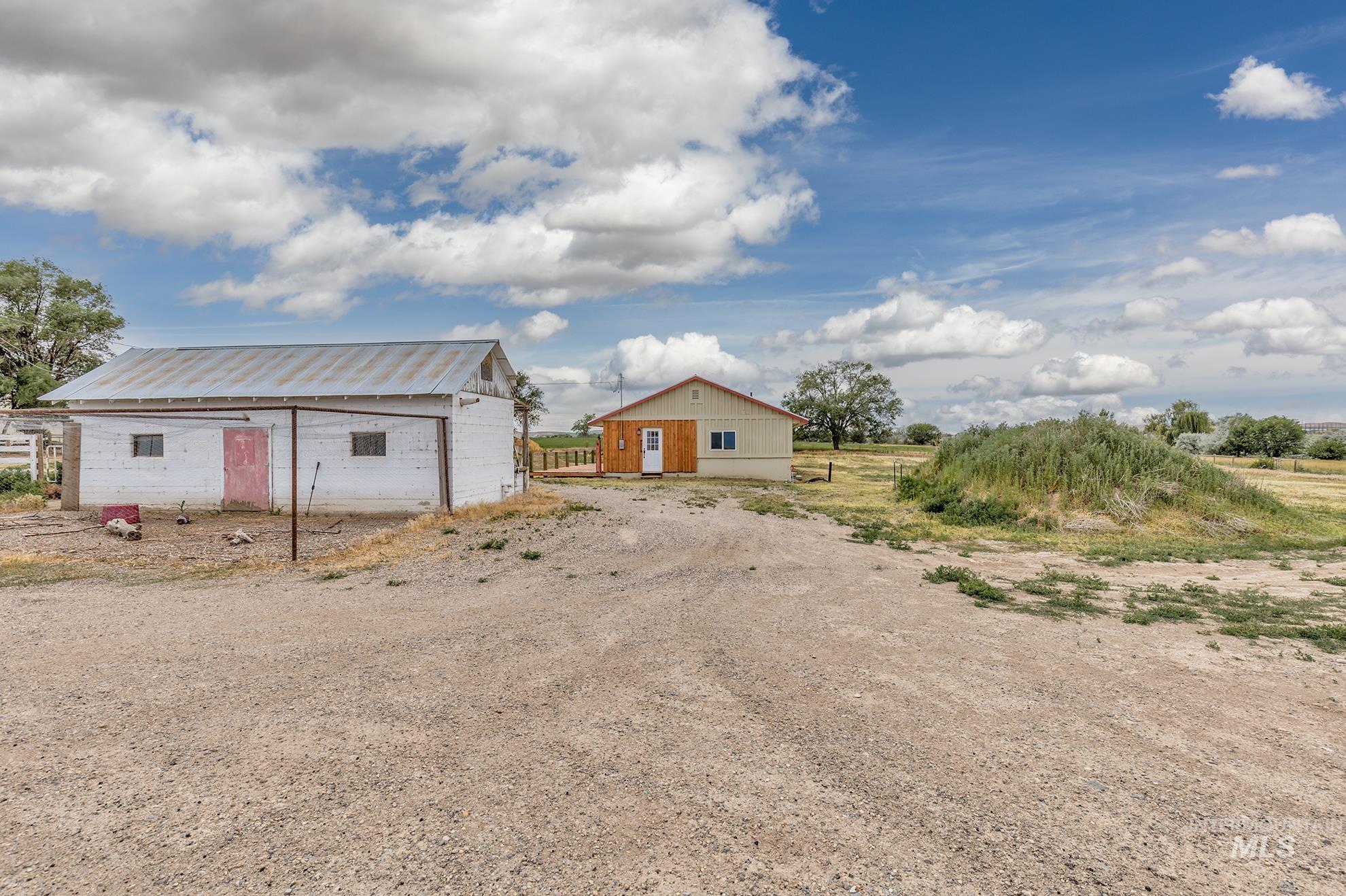 View of outbuilding with driveway