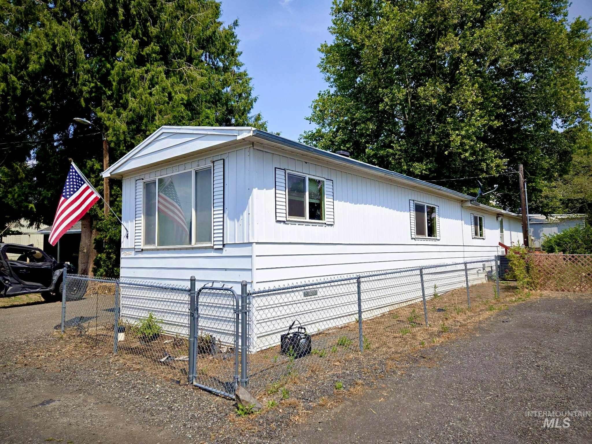 View of side of property featuring a fenced front yard