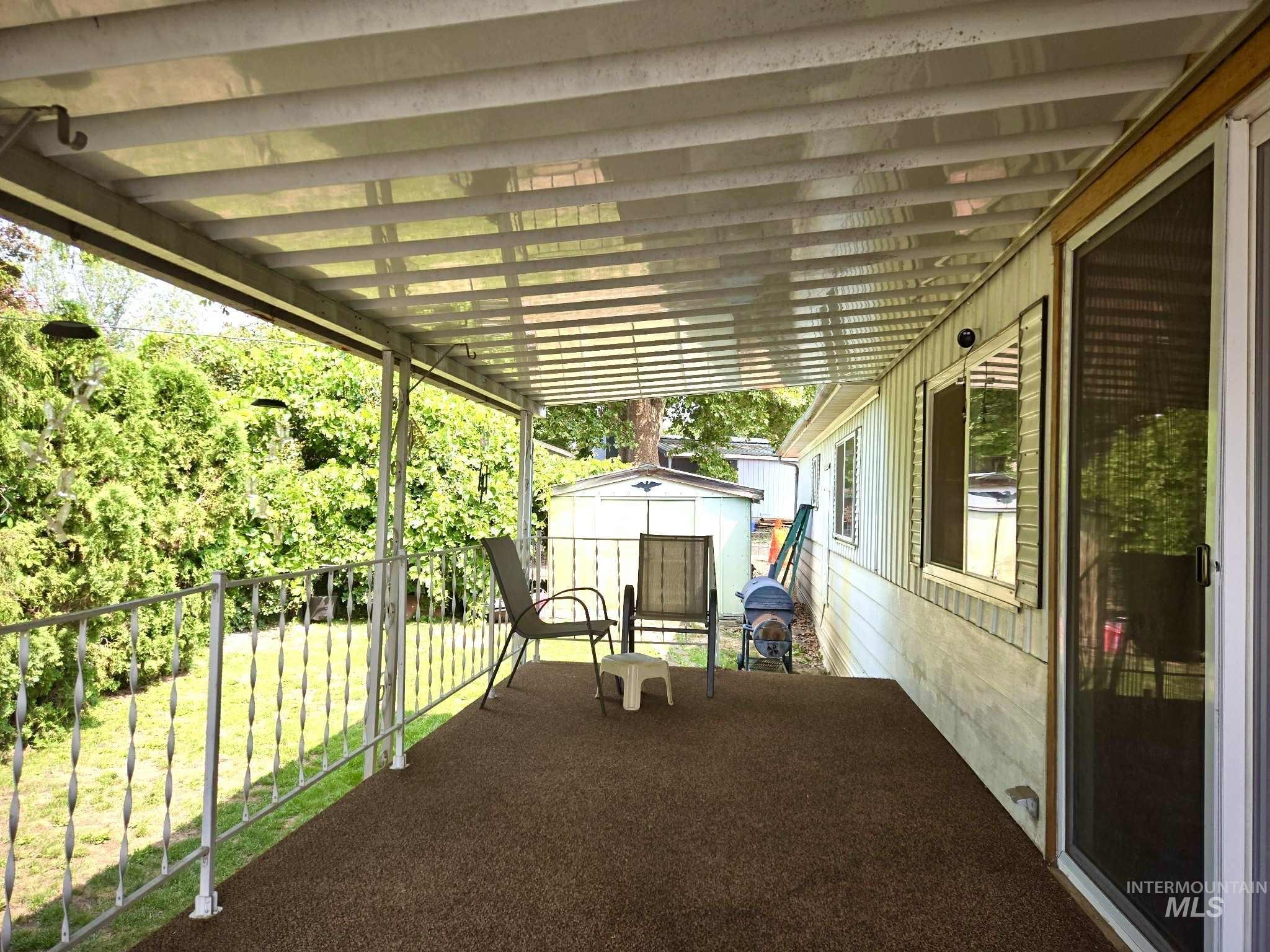 View of patio / terrace featuring a storage shed