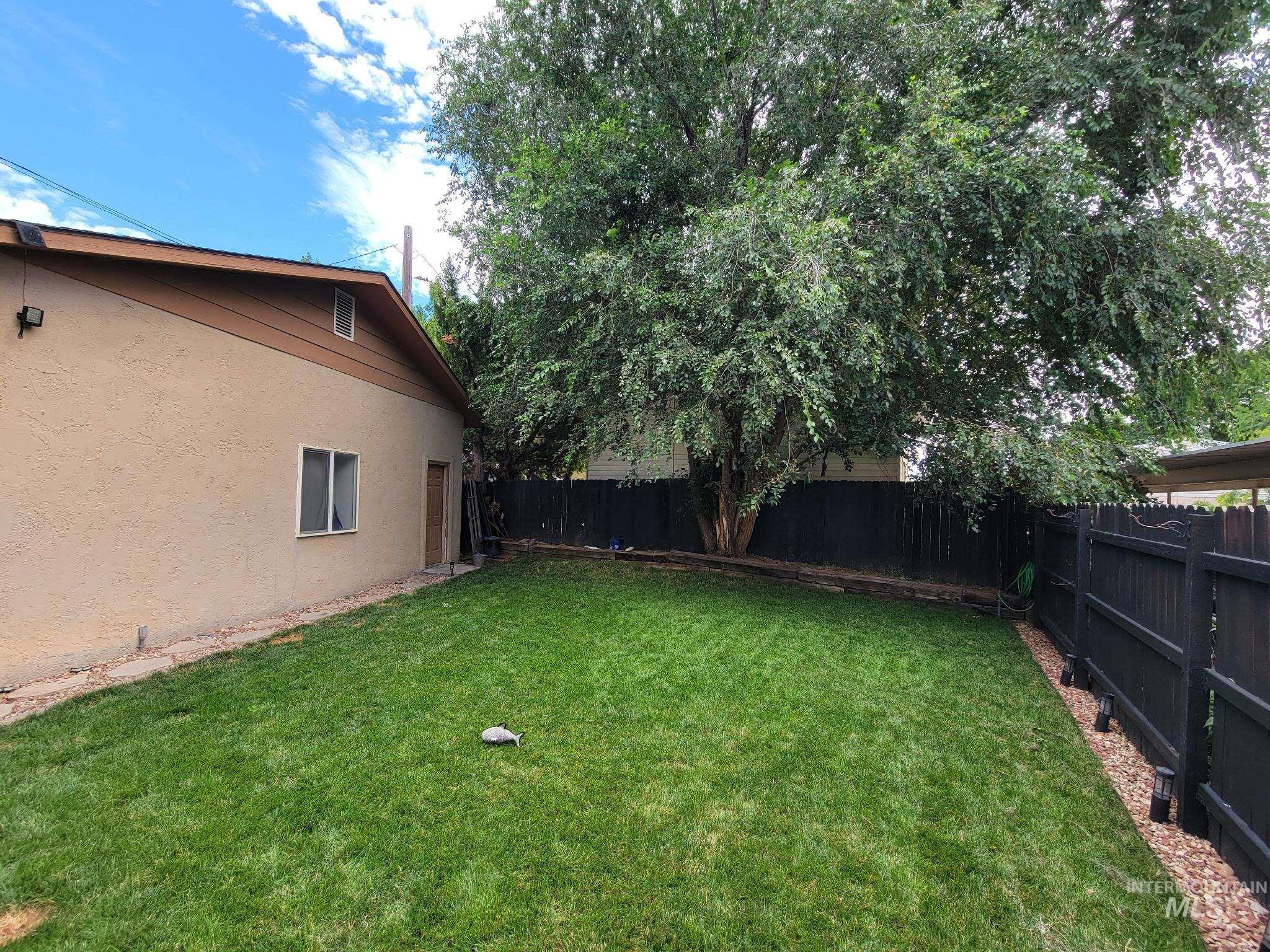 View of fenced backyard