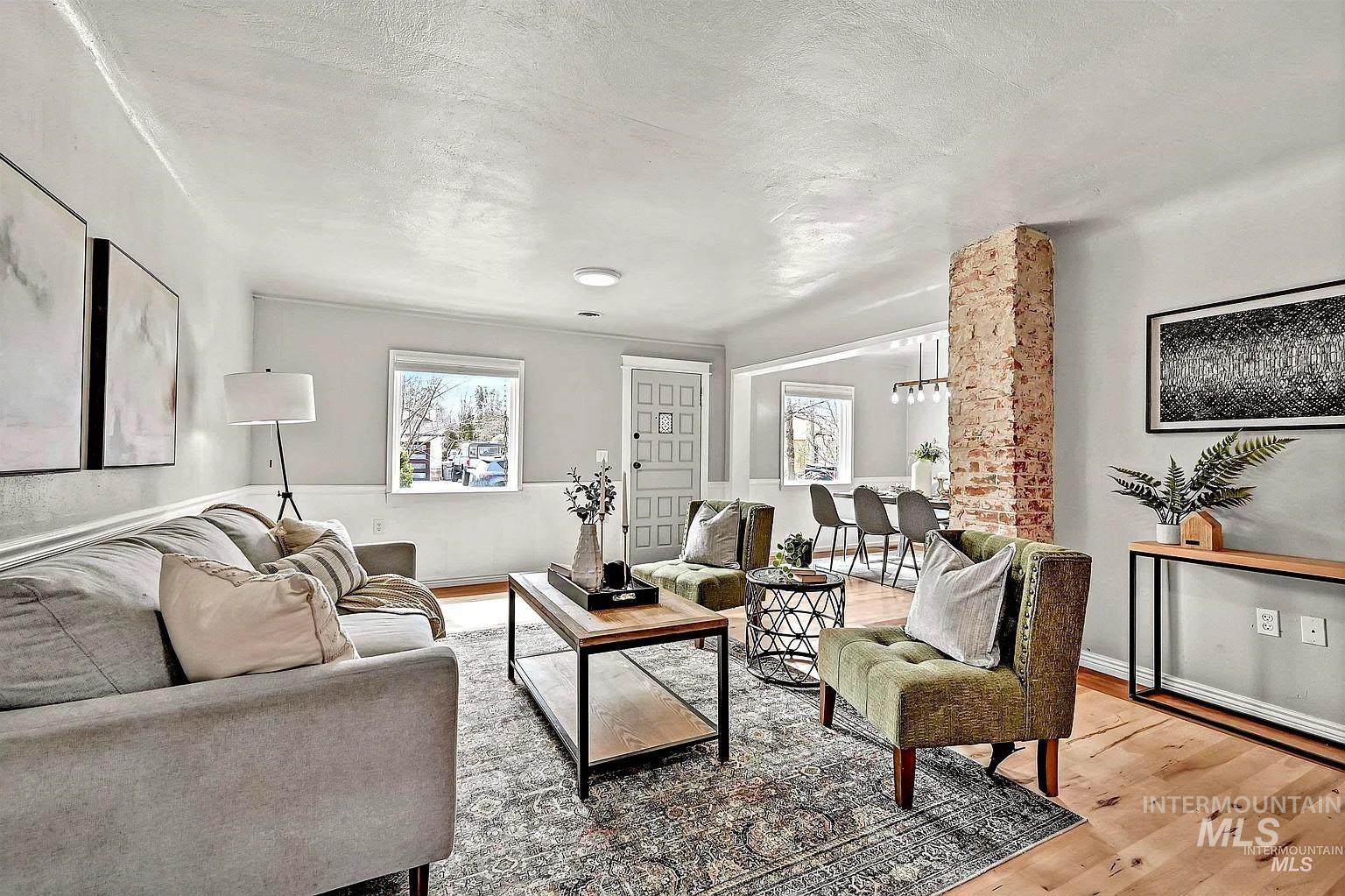 Living area featuring light wood finished floors and baseboards
