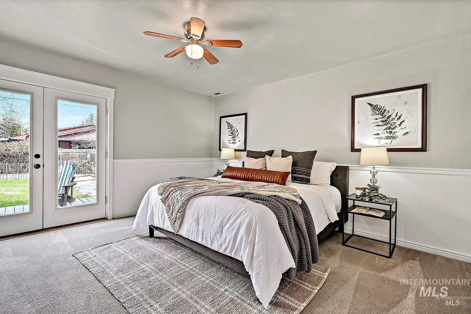 Bedroom featuring access to outside, carpet, french doors, and a ceiling fan