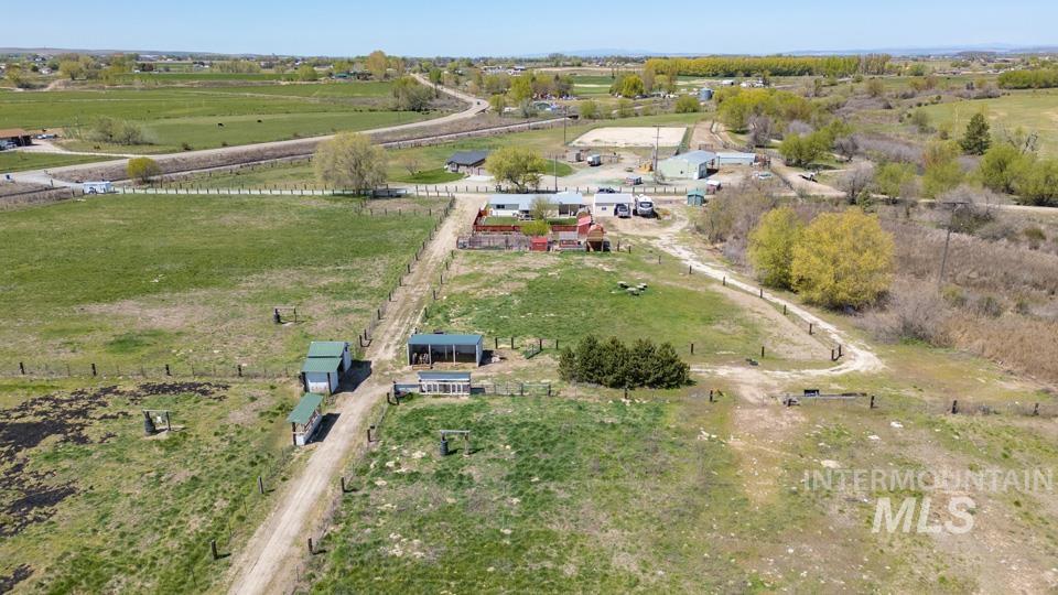 Aerial view of property and surrounding area with rural landscape