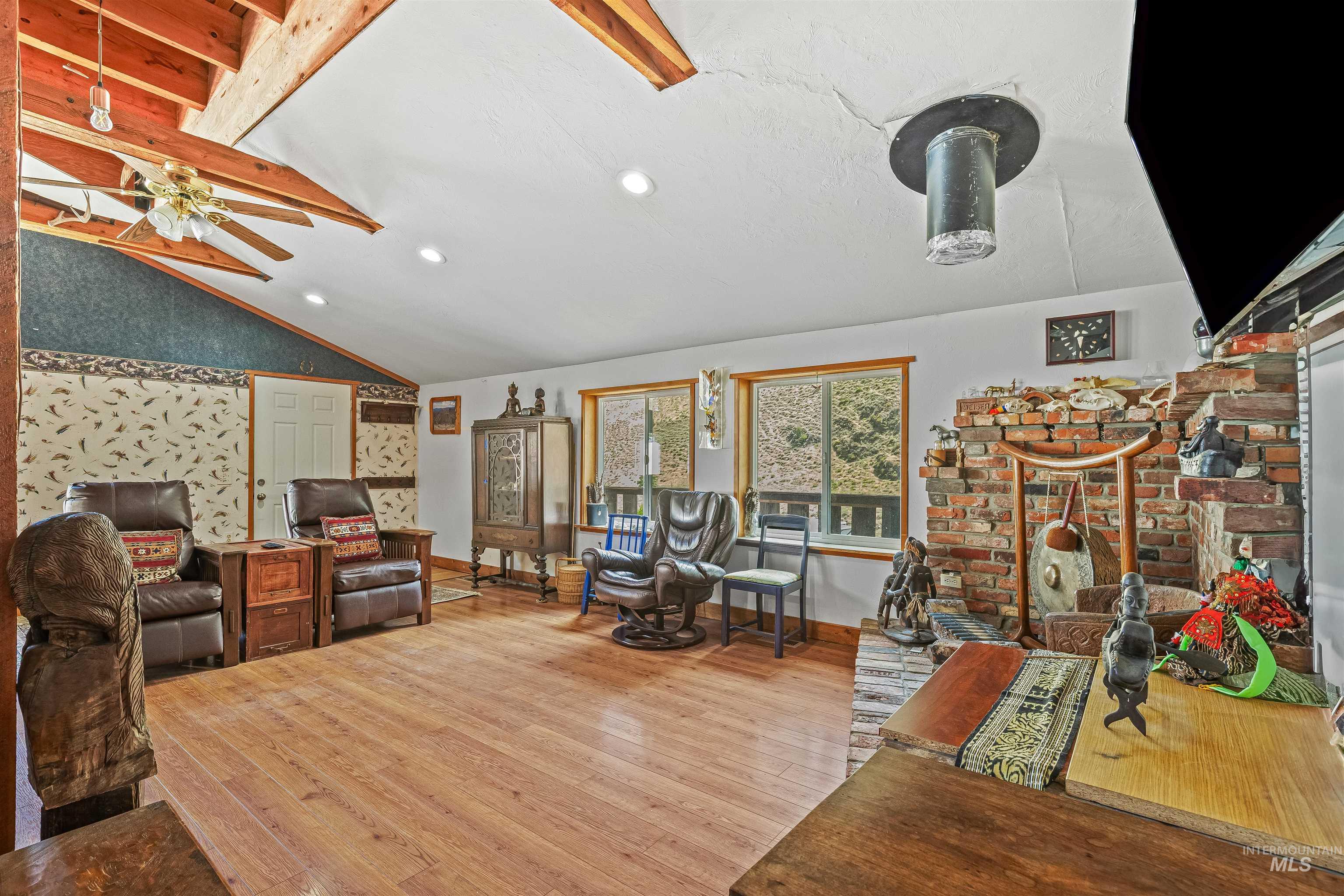 Living area with hardwood / wood-style flooring, recessed lighting, and a ceiling fan