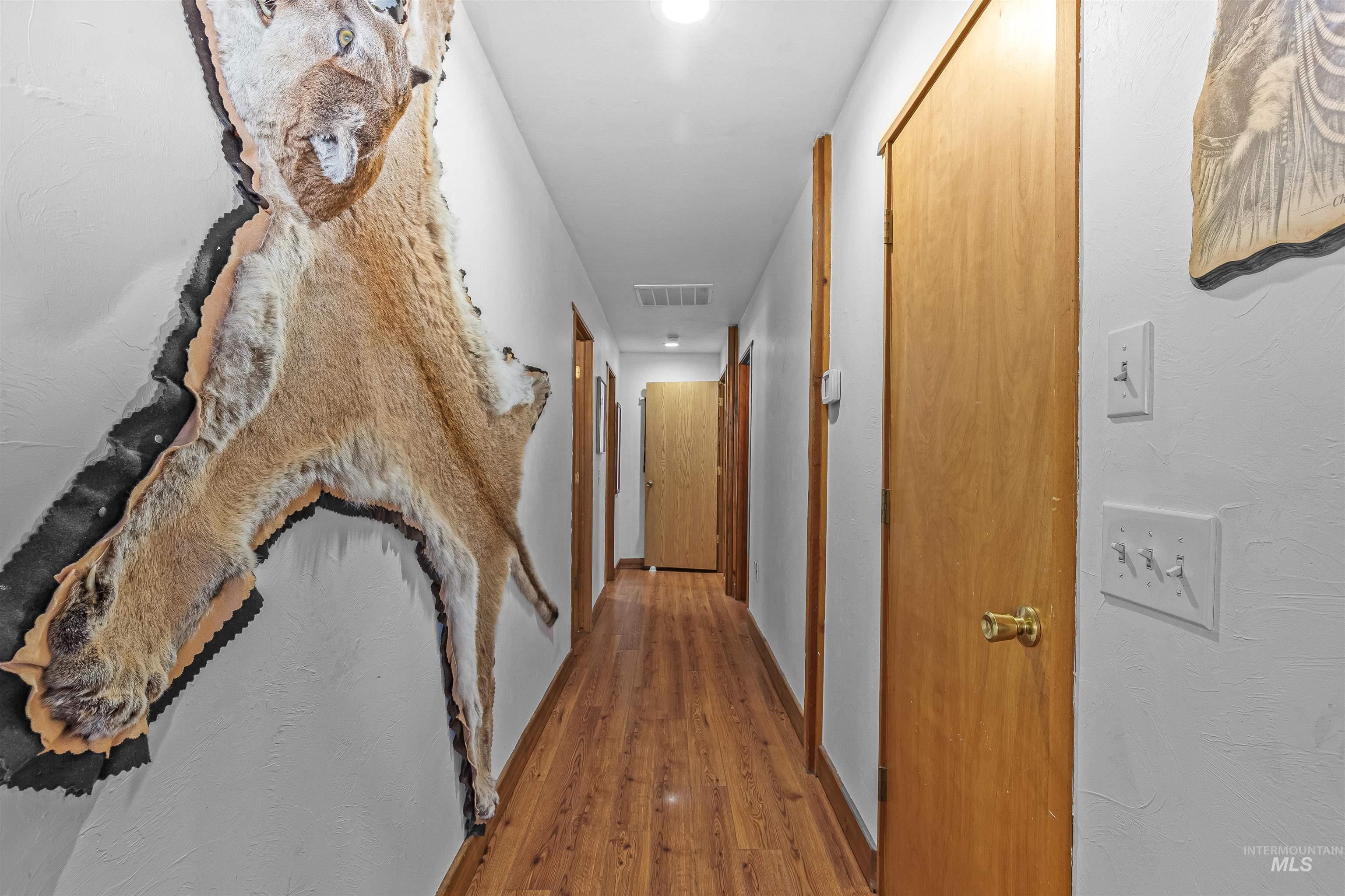 Hall featuring wood finished floors