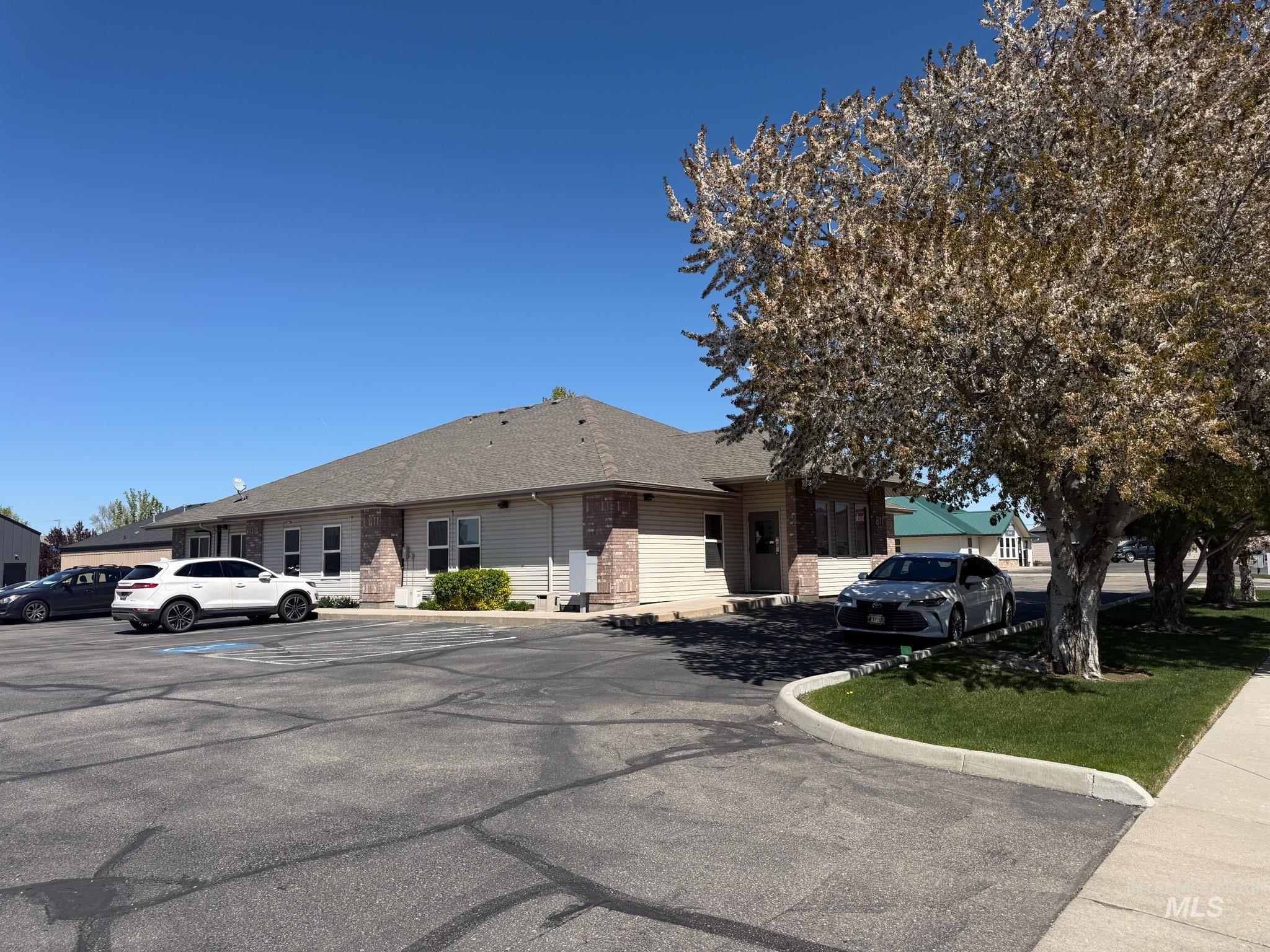 View of front of house featuring uncovered parking