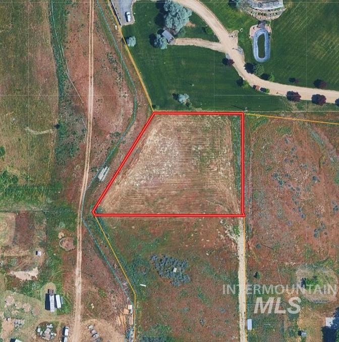 Aerial view of property\'s location with property parcel outlined