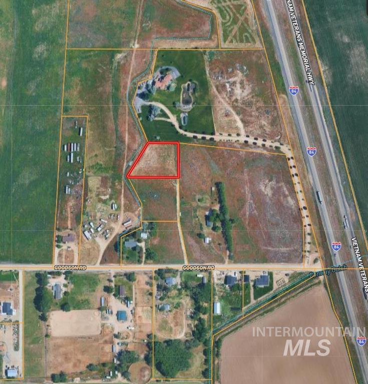 Aerial map of property and surrounding area featuring property parcel outlined