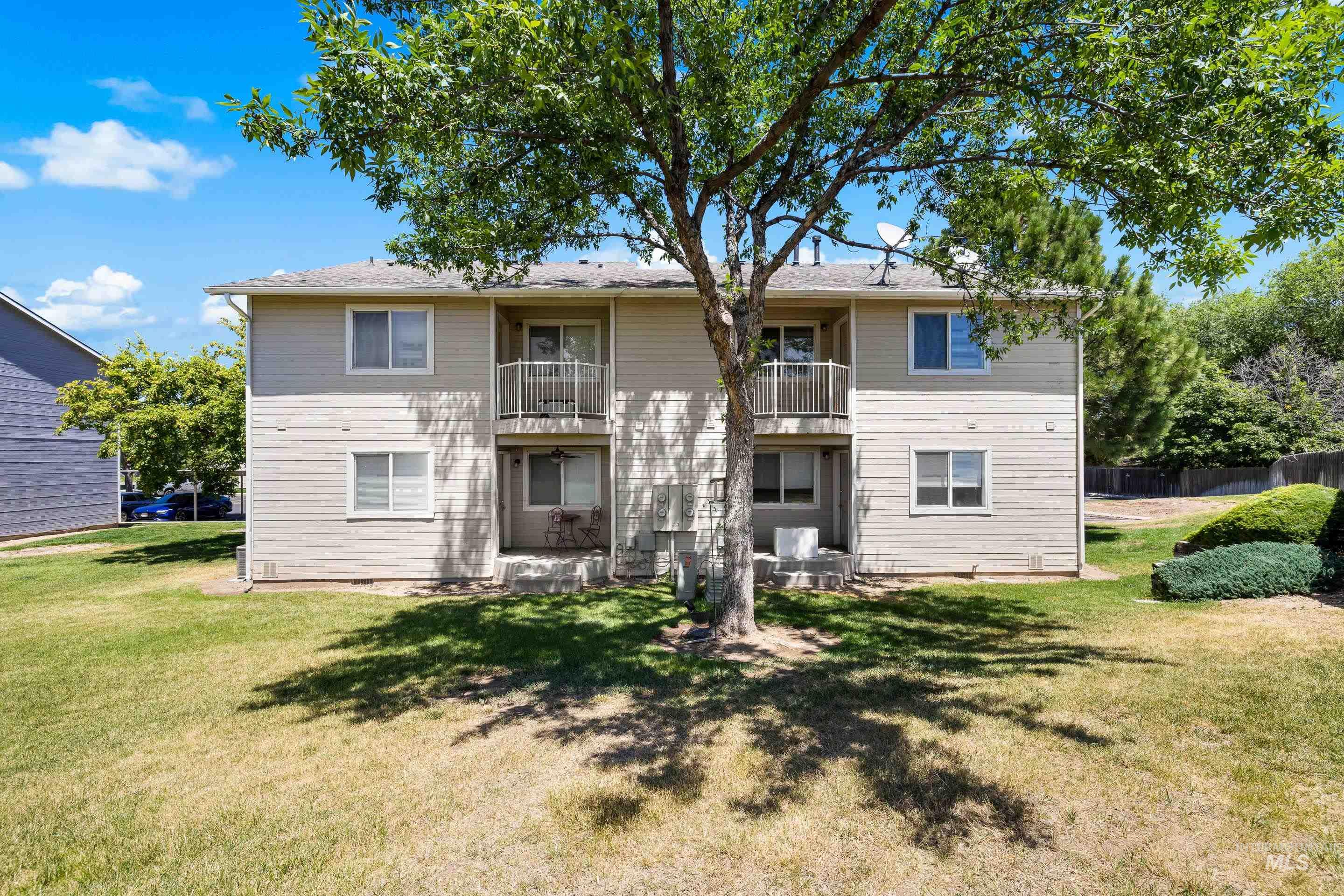 Rear view of property with a balcony