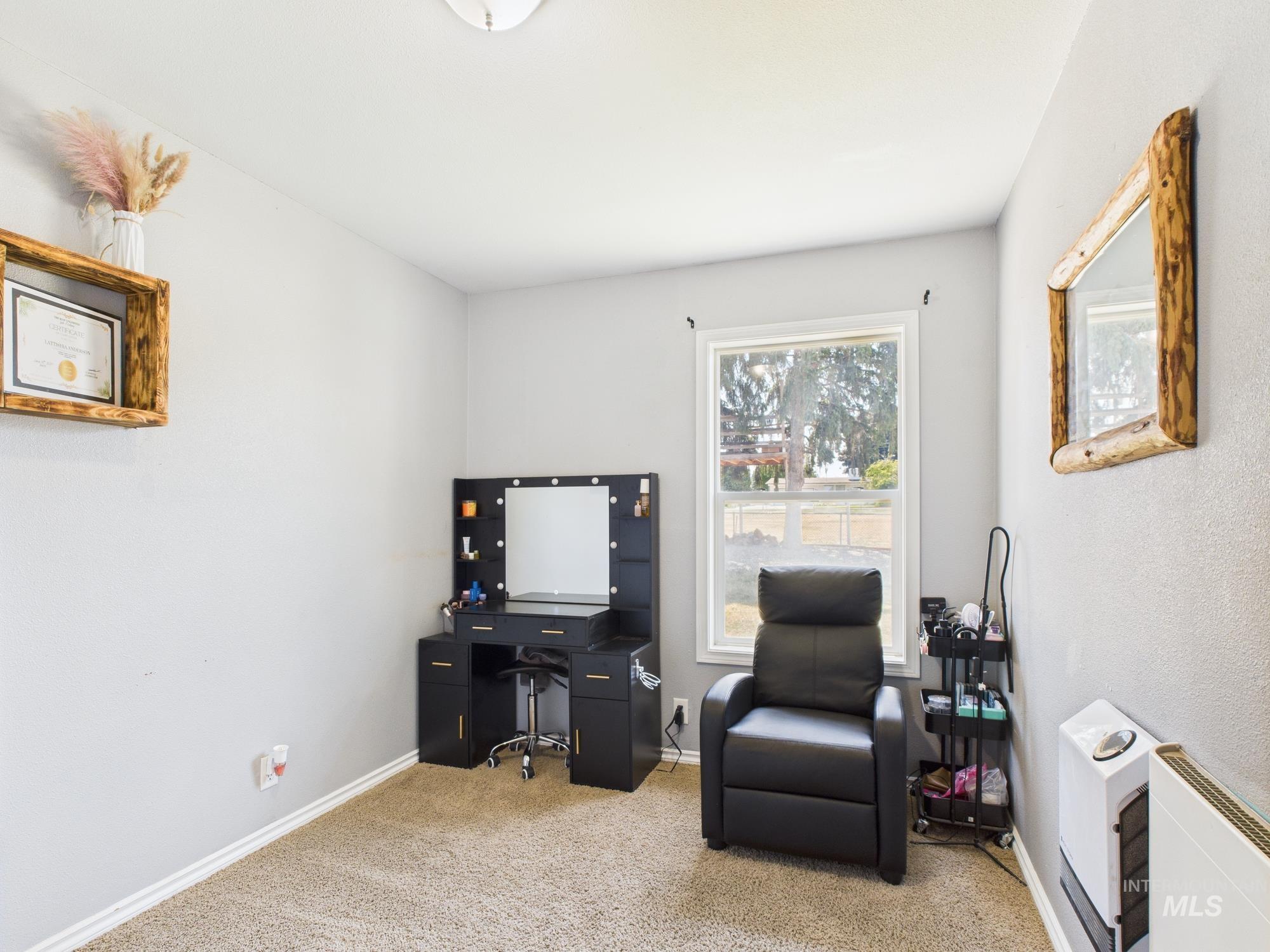 Living area featuring carpet flooring and an office area