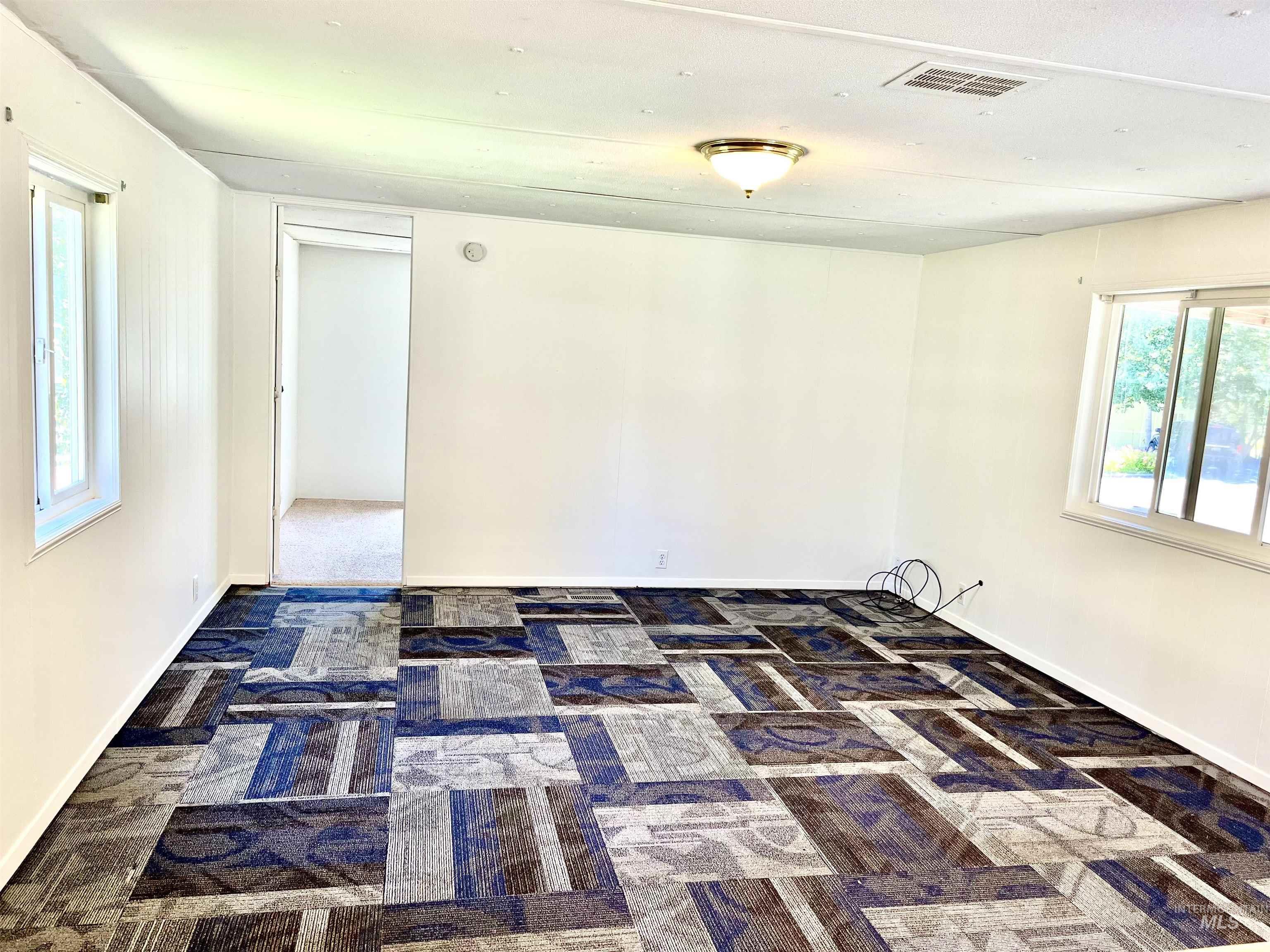 Empty room with baseboards