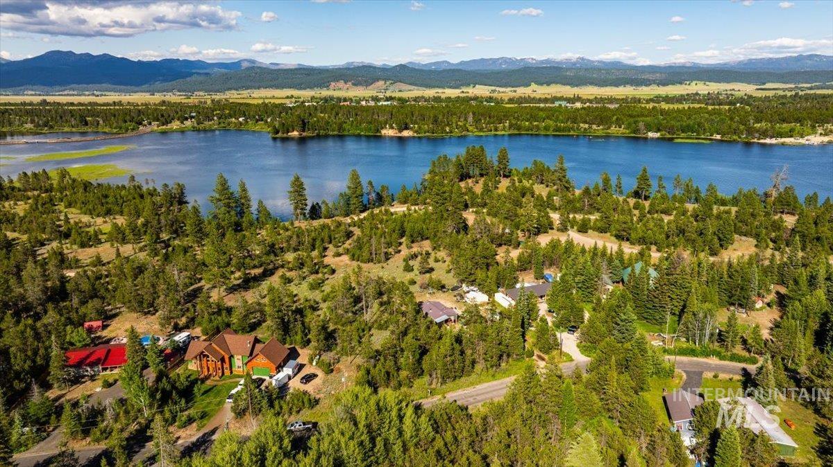 Aerial overview of property\'s location featuring a water and mountain view