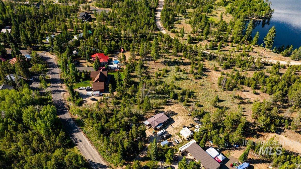 Aerial view of property and surrounding area with a large body of water