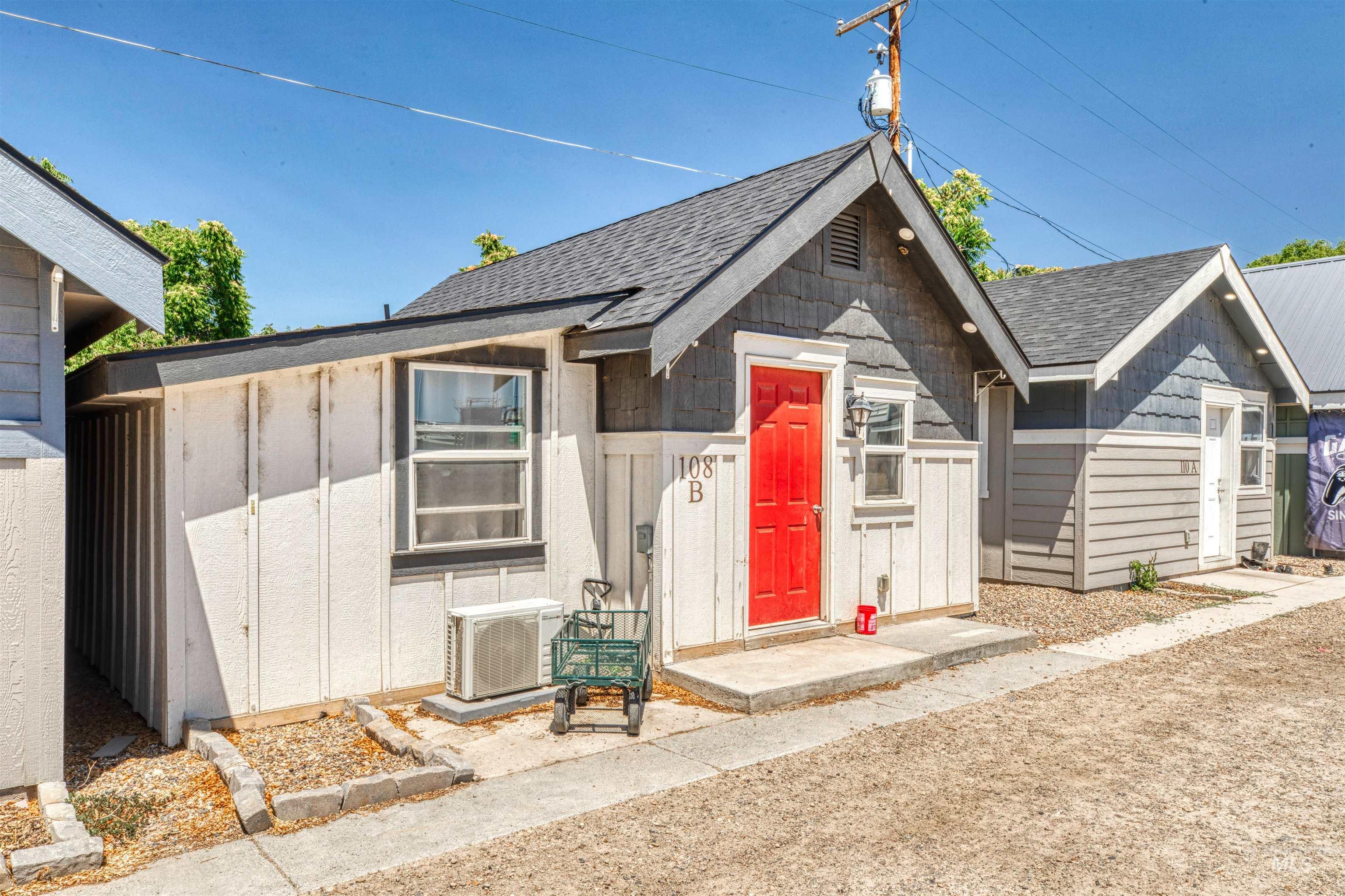 View of front of house featuring roof with shingles