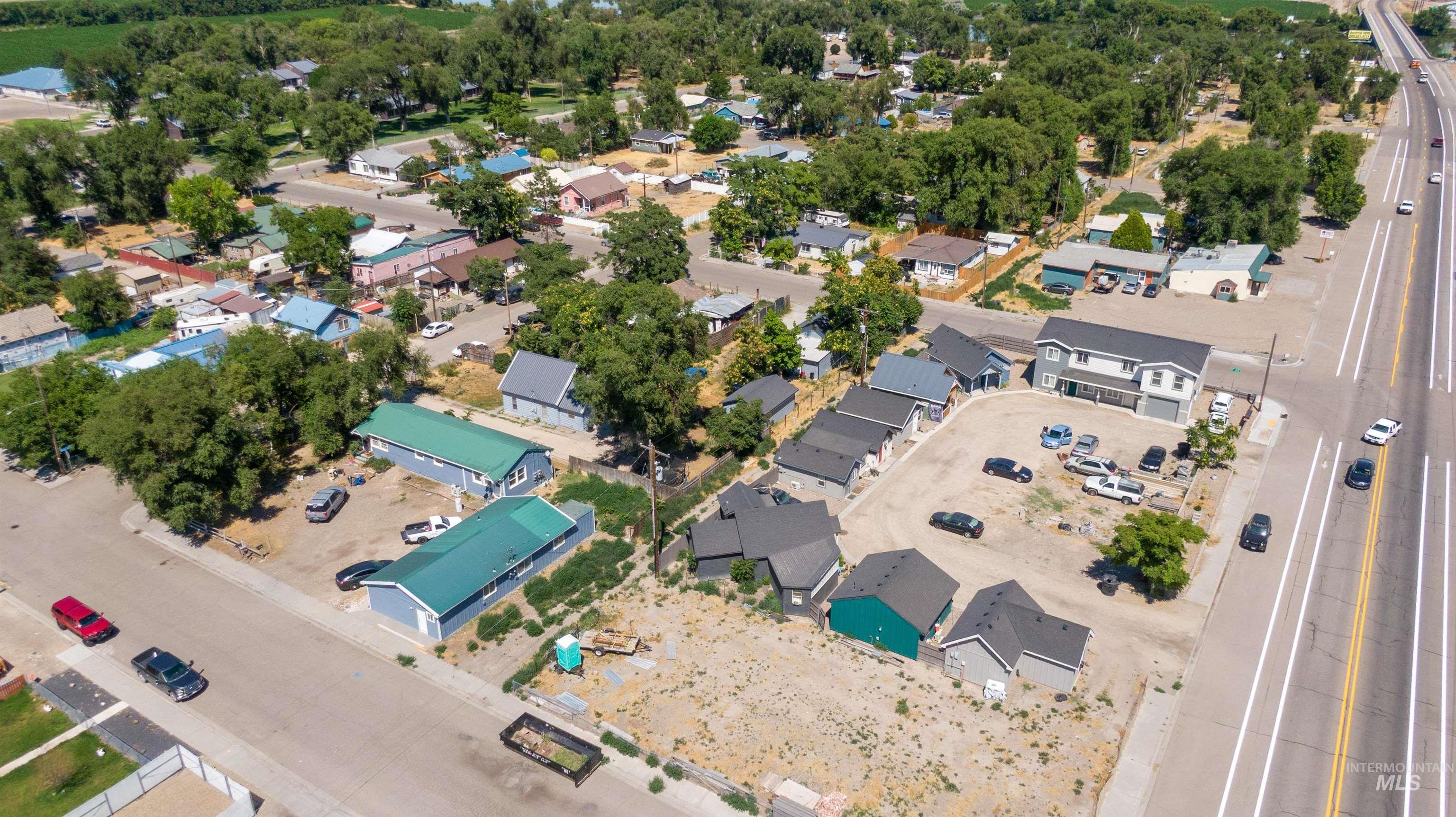 Aerial view of property's location with nearby suburban area