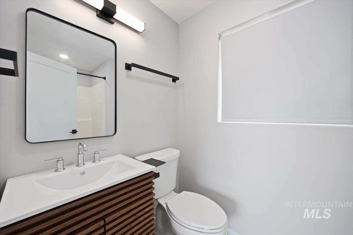 Bathroom featuring toilet and vanity