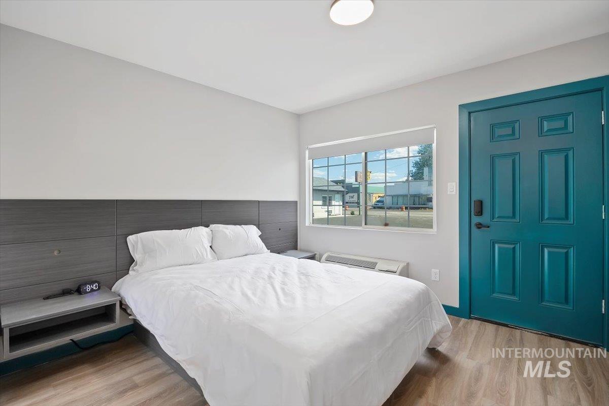Bedroom with wood finished floors