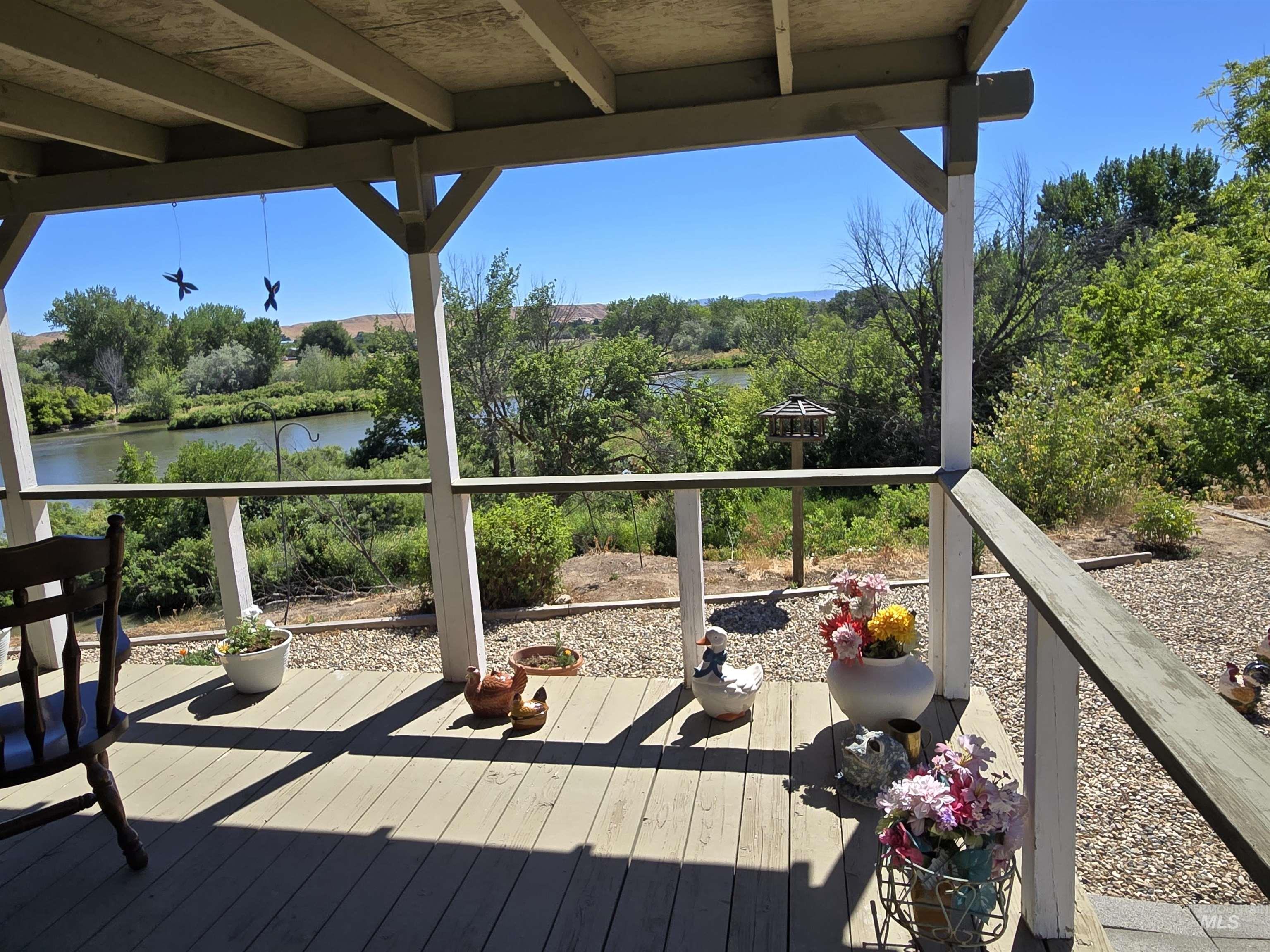 Wooden deck featuring a water view