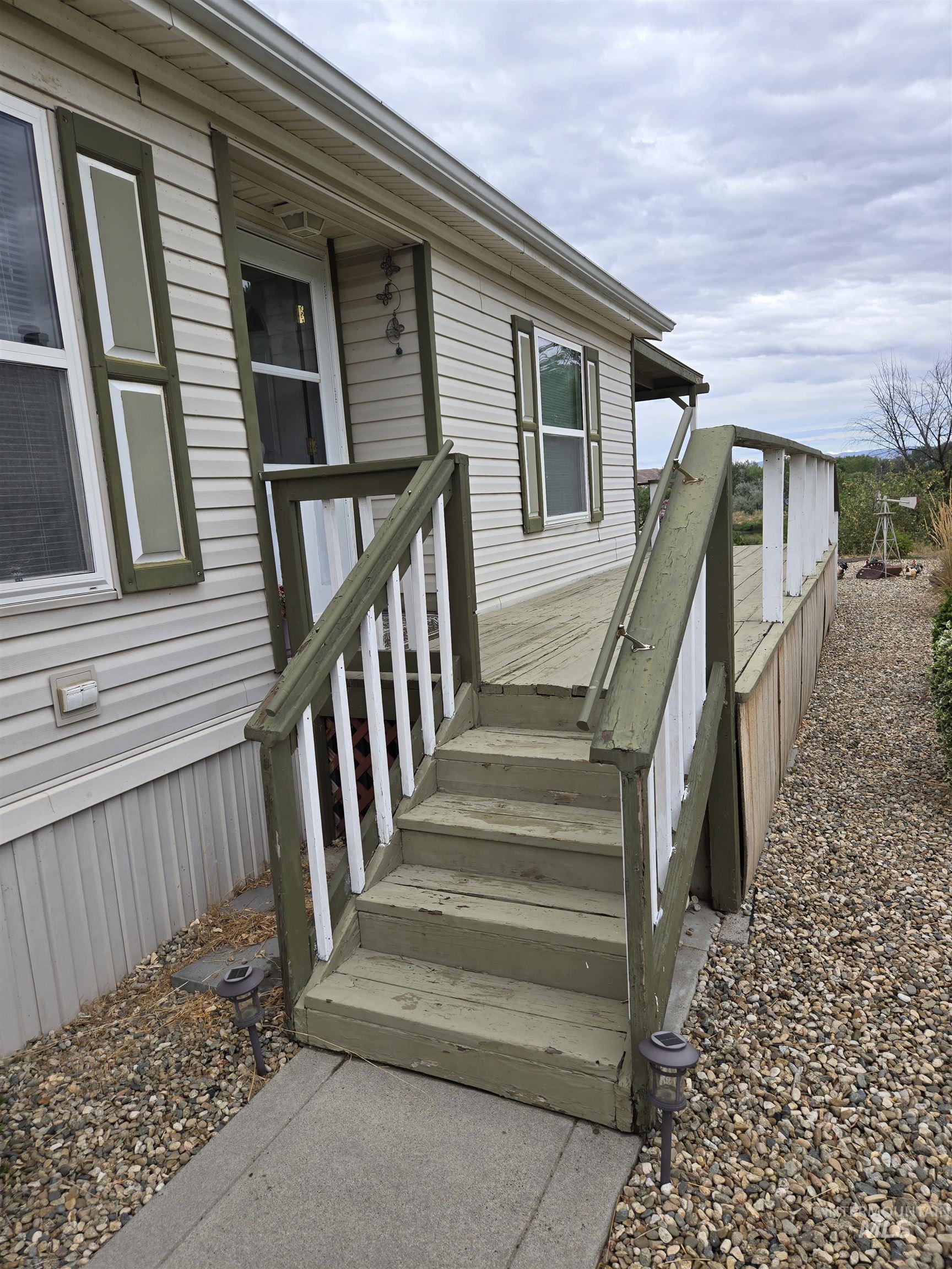 Doorway to property featuring a deck