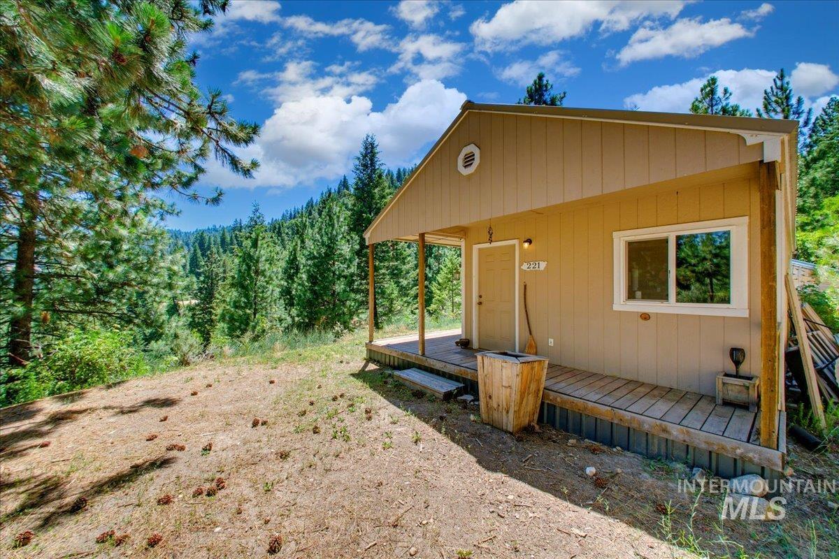 View of outdoor structure featuring a forest view