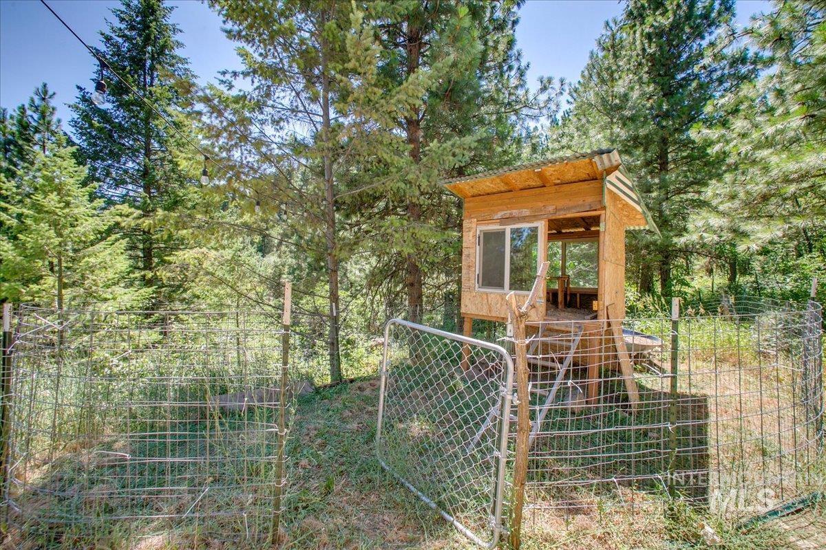 View of outdoor structure with a gate