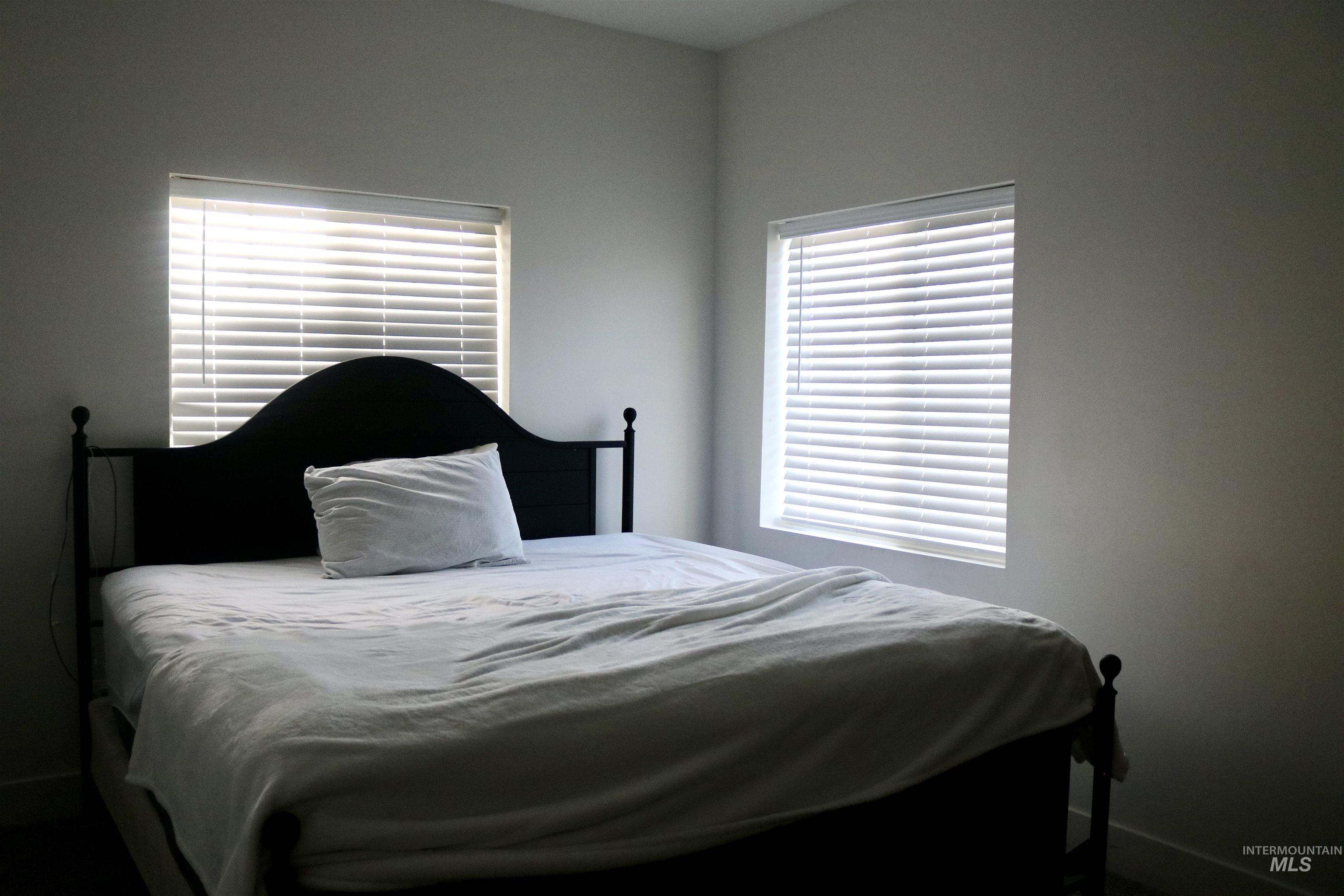 Bedroom featuring multiple windows
