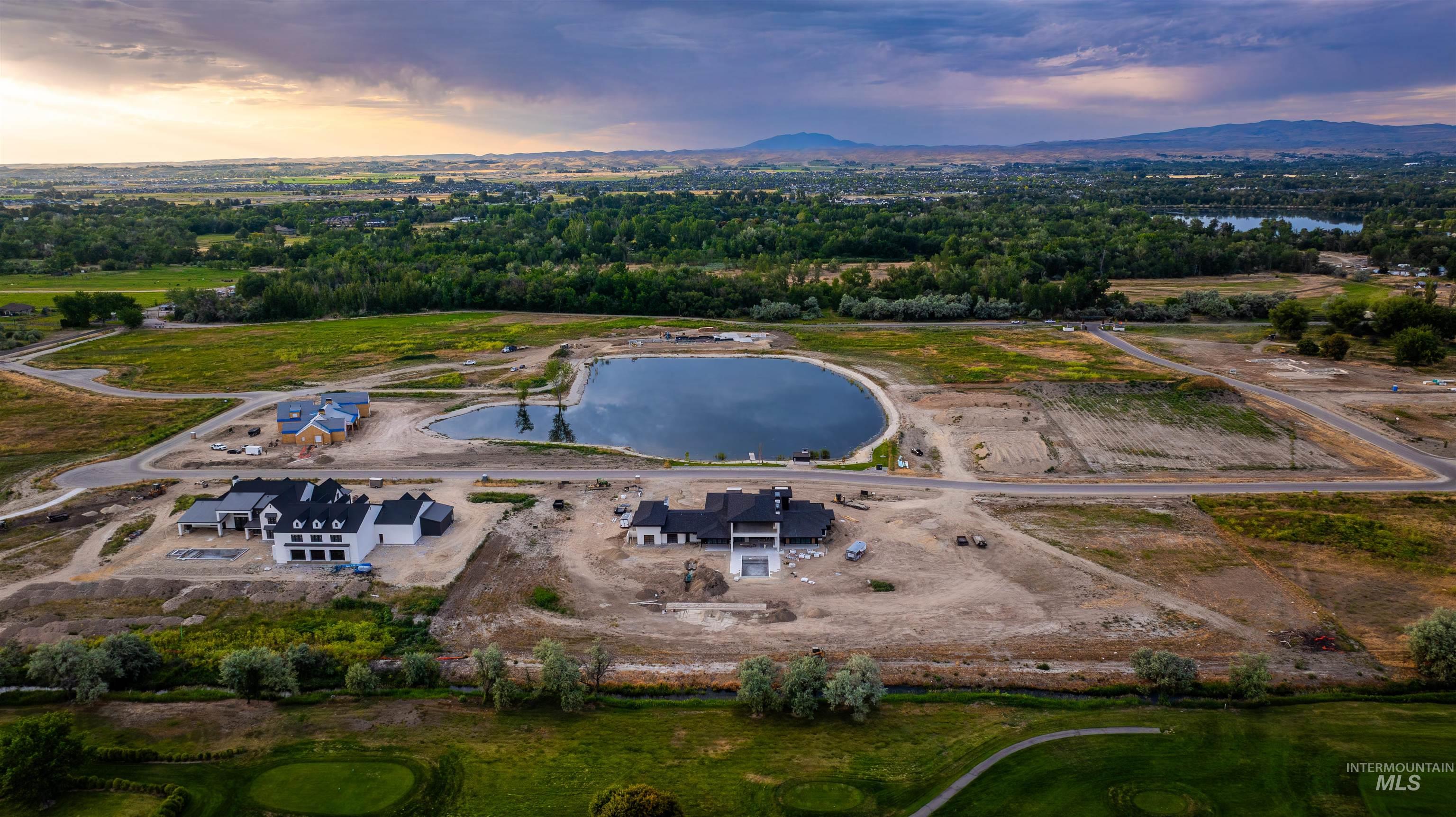 Aerial view of property's location featuring a water and mountain view