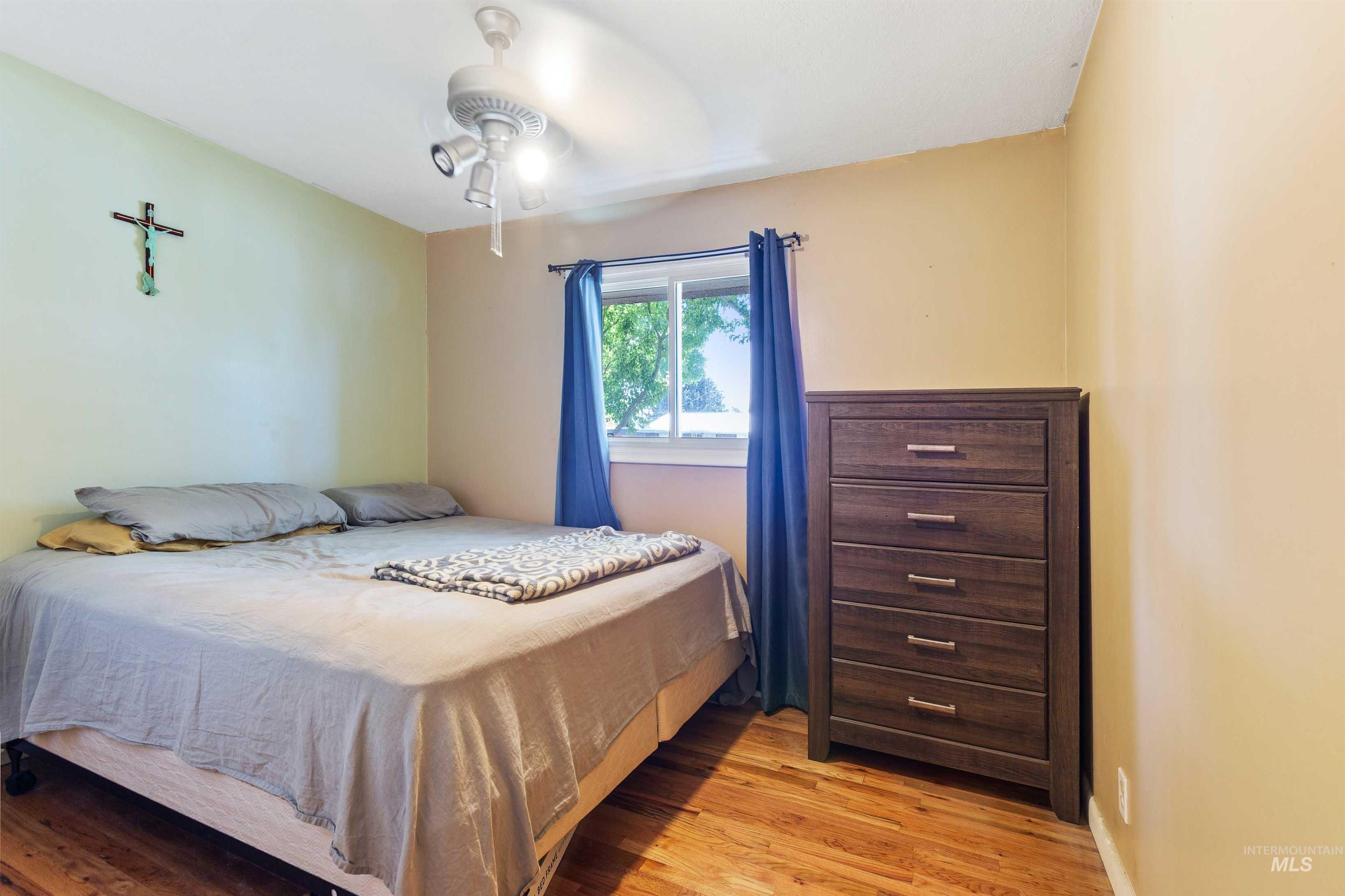 Bedroom with light wood finished floors