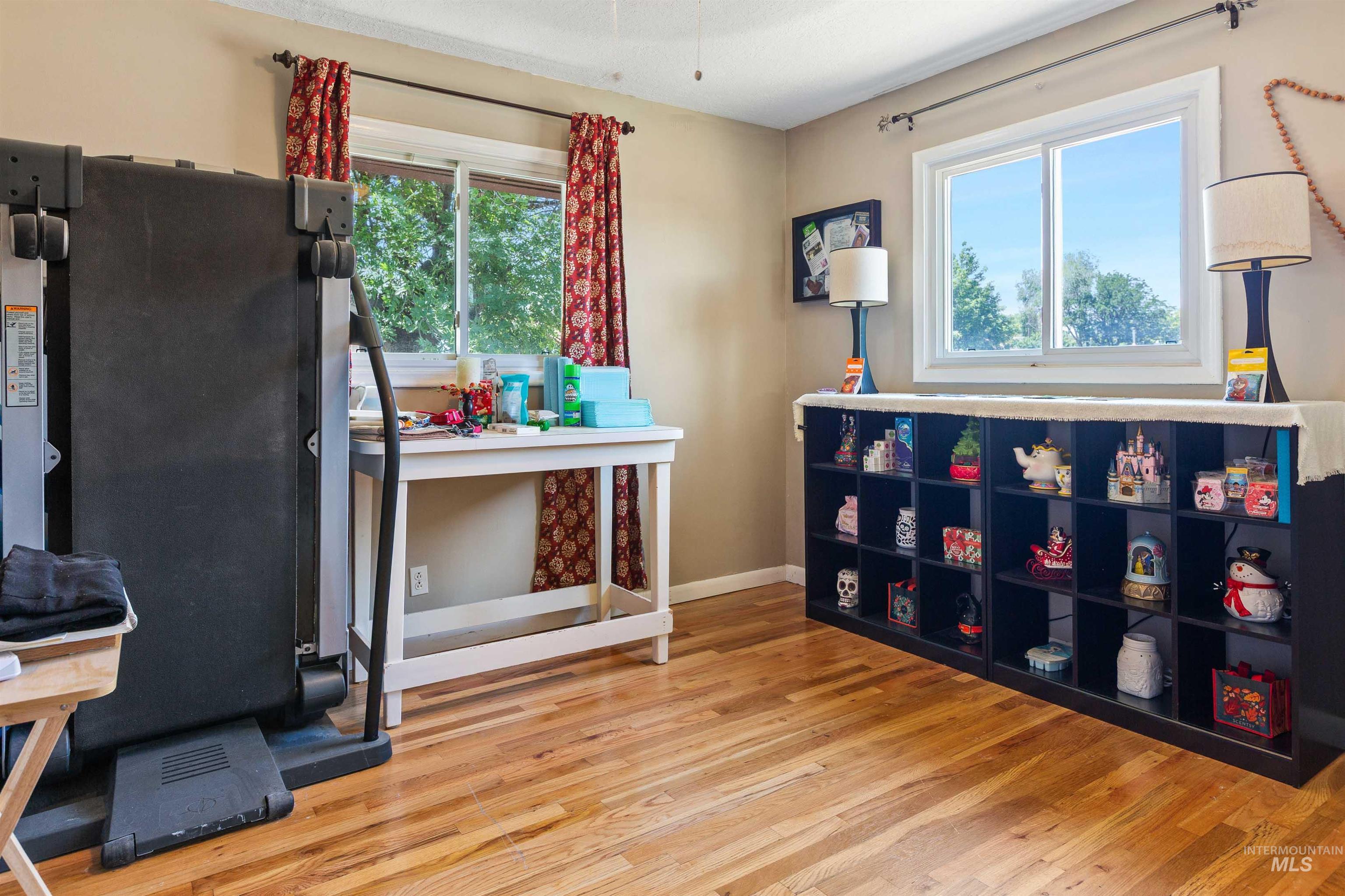 Miscellaneous room featuring wood finished floors