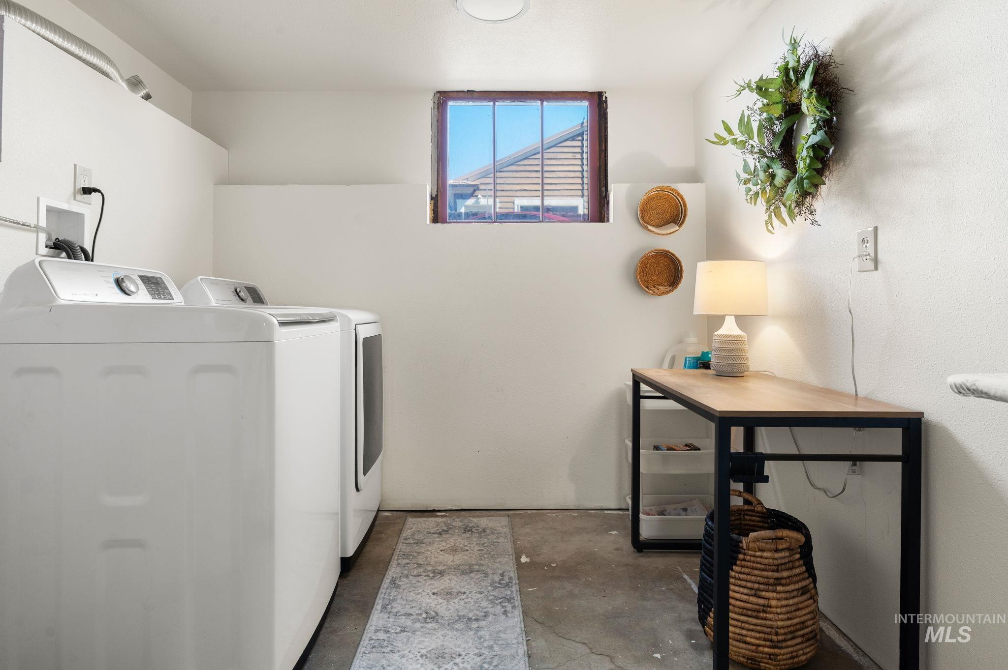 Laundry room featuring separate washer and dryer