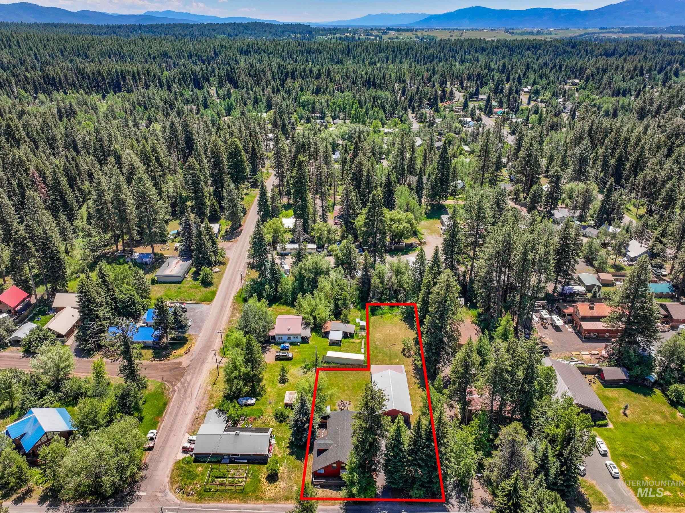 Aerial overview of property's location featuring mountains and property parcel outlined
