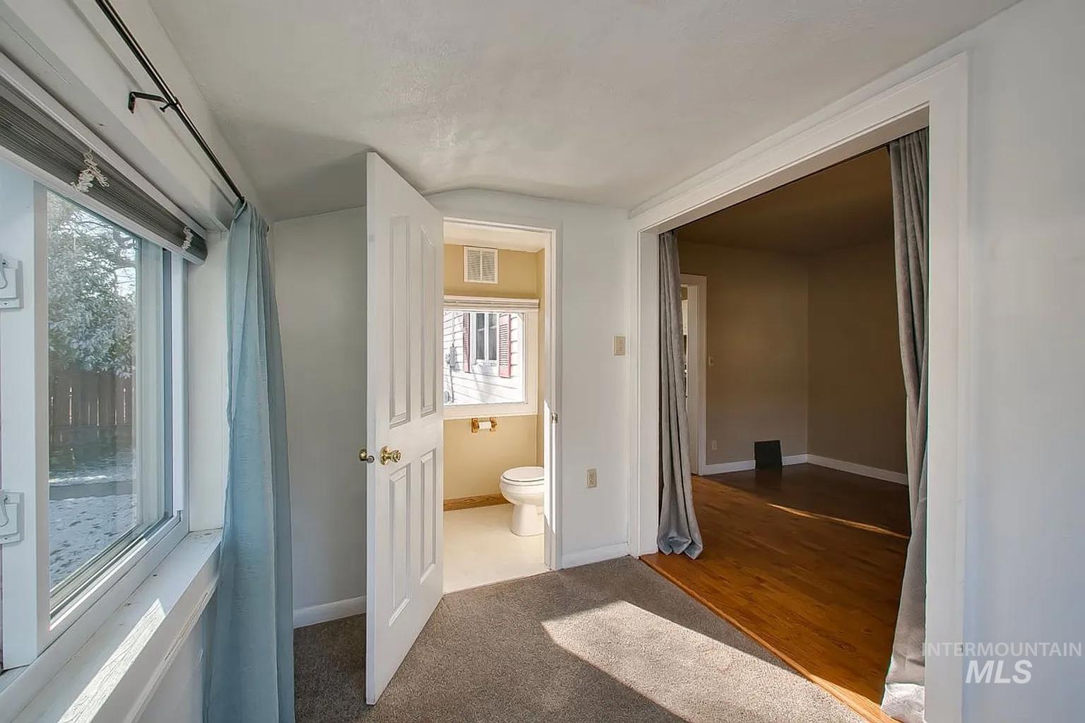 Hallway featuring plenty of natural light
