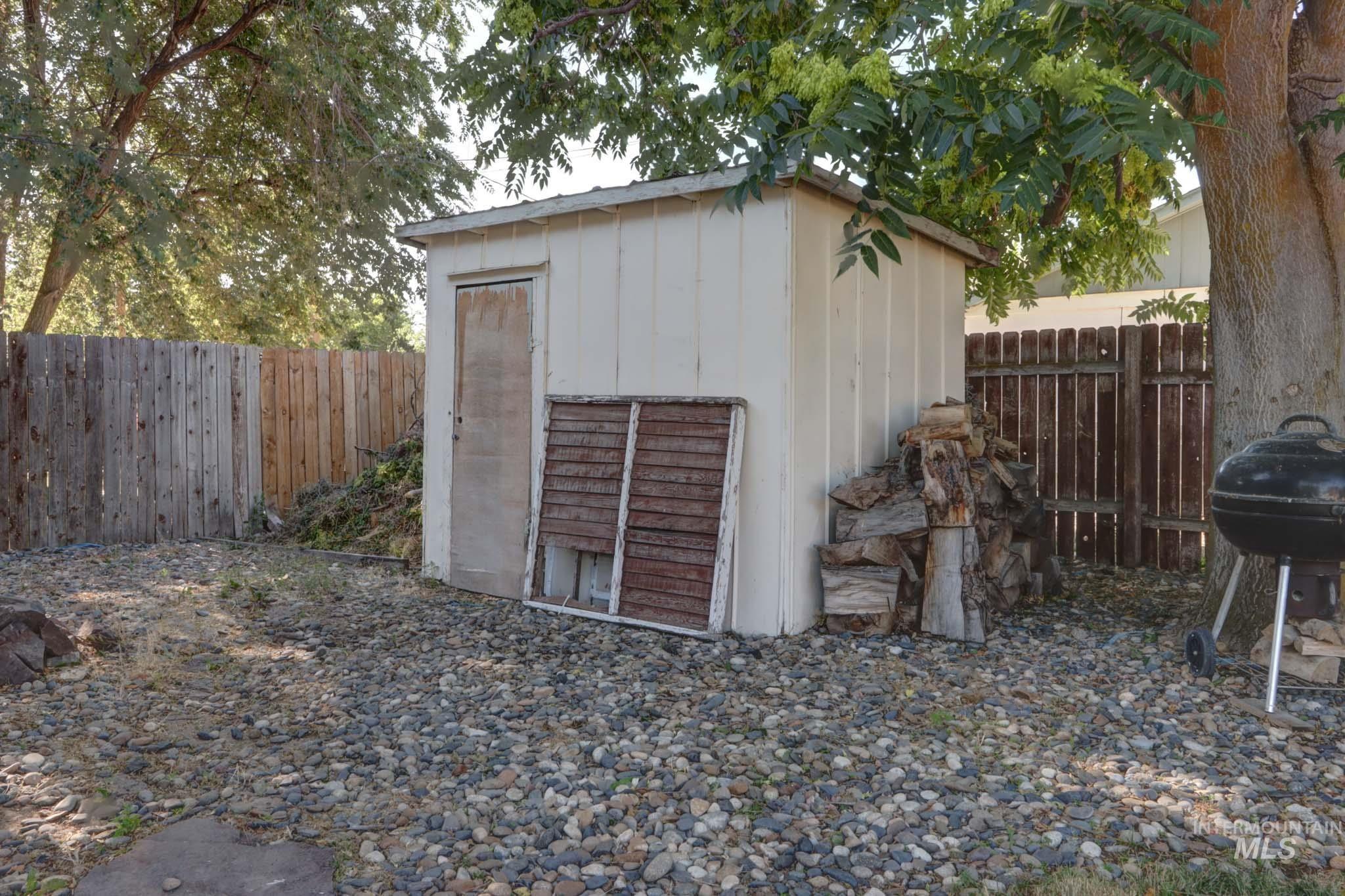 View of shed with a fenced backyard