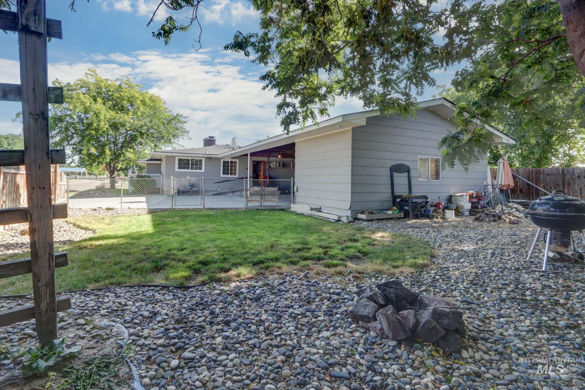 Back of property featuring a fenced backyard and a patio area