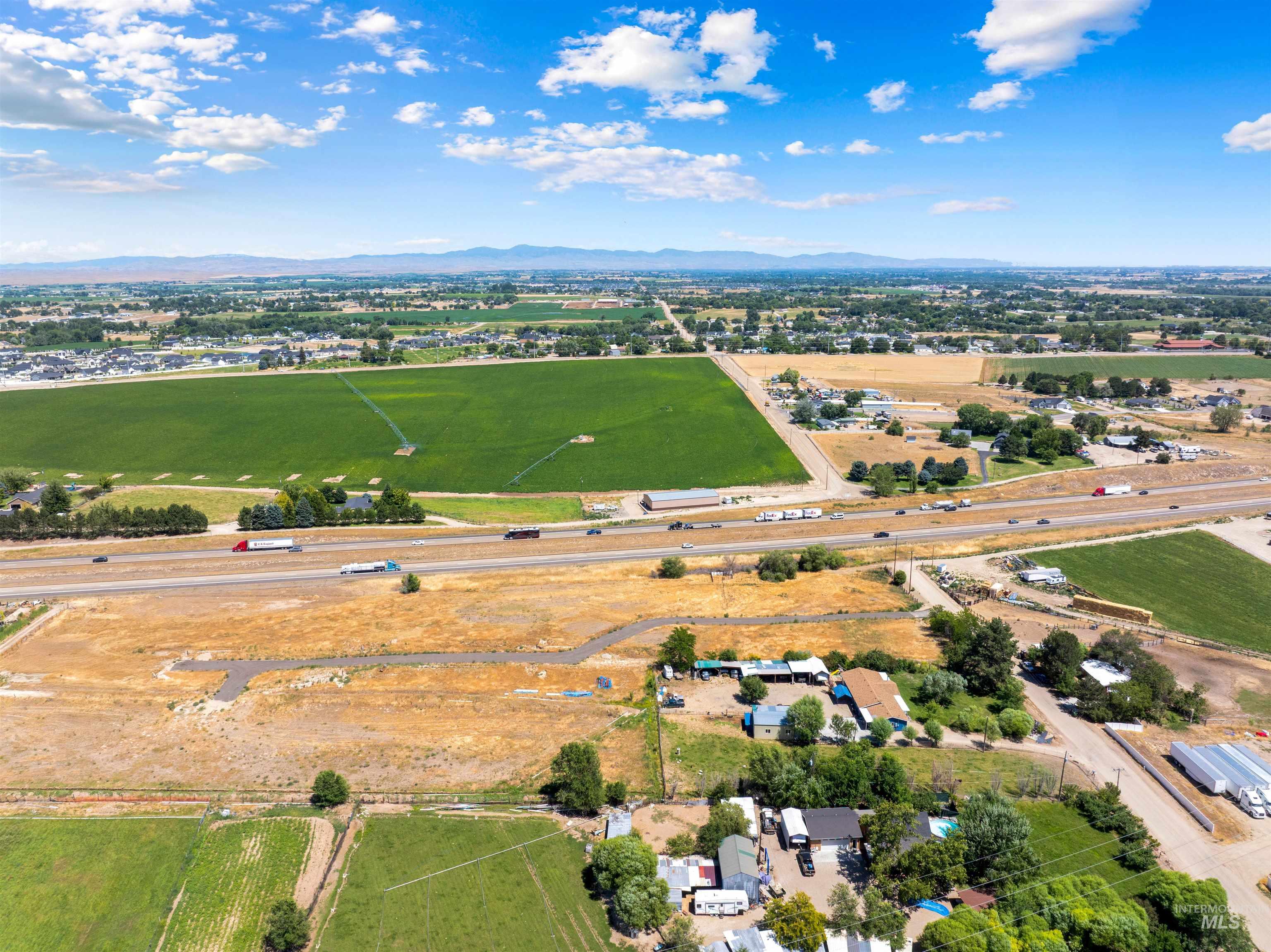 Aerial view of sparsely populated area featuring a mountain backdrop