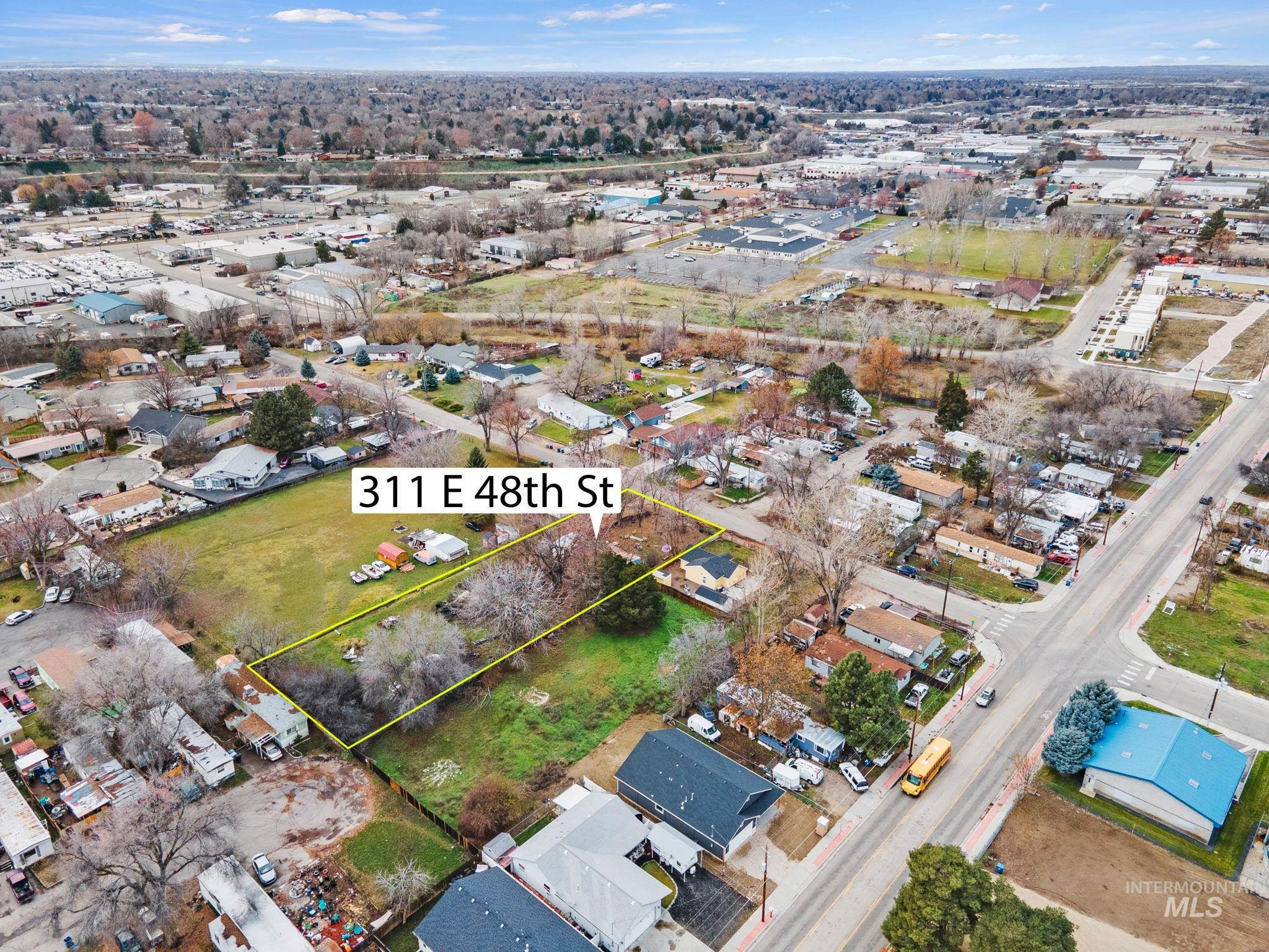 Aerial view of residential area with property boundaries highlighted