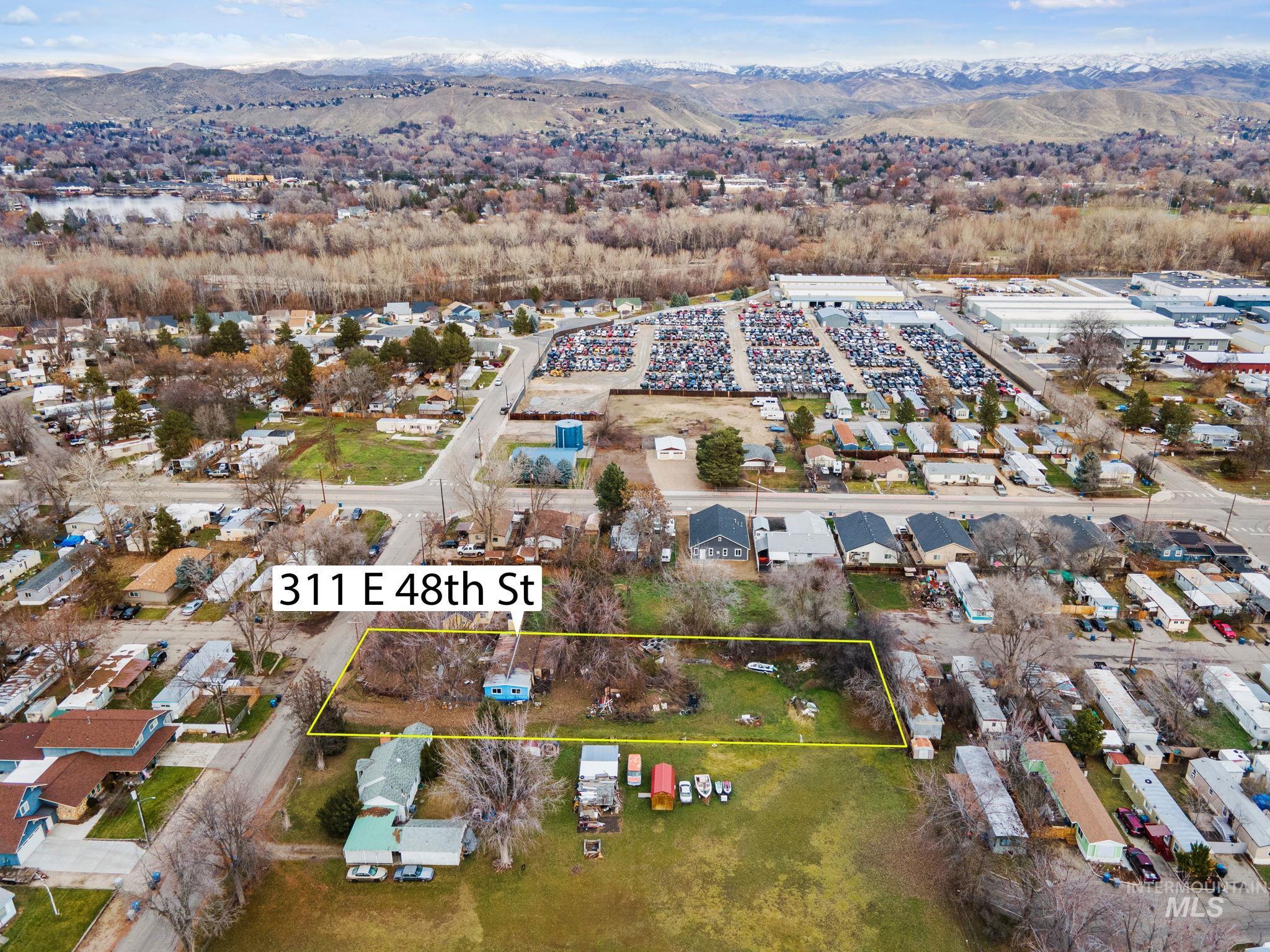 Aerial overview of property's location with mountains and property parcel outlined