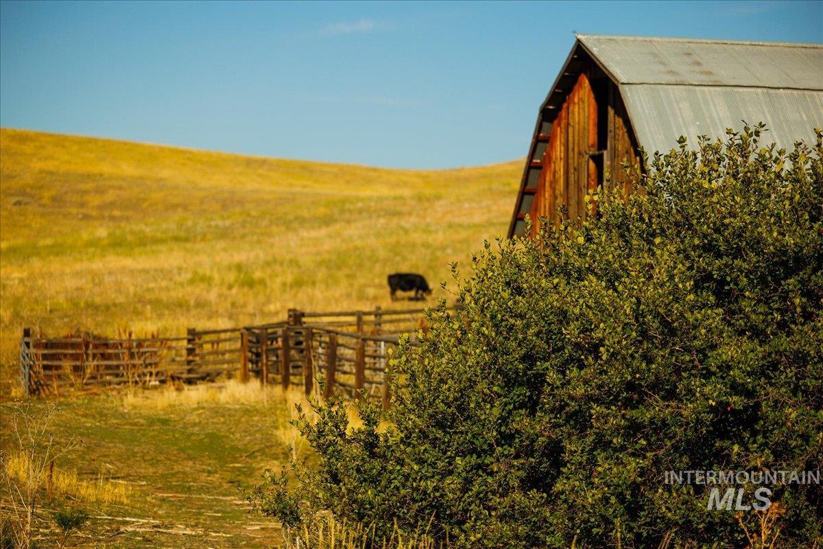 View of yard with a view of countryside and a barn