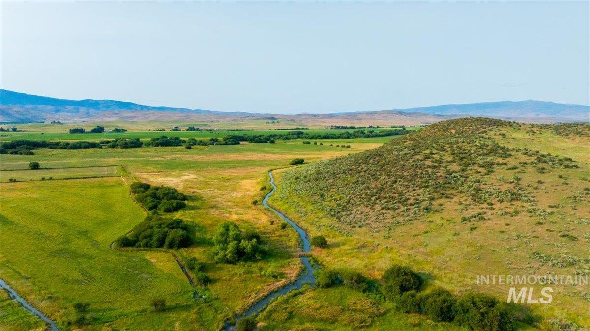 Overview of rural landscape featuring a mountainous background