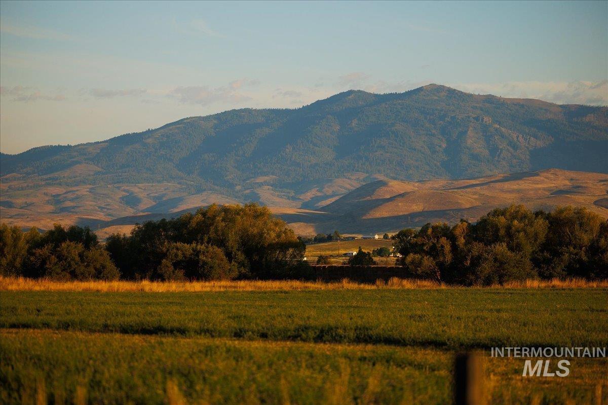 View of mountain backdrop featuring rural landscape