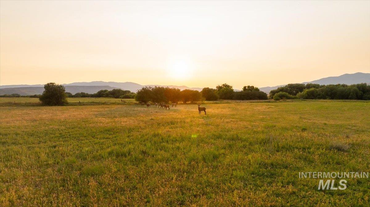 Nature at dusk with a mountain view and a rural view