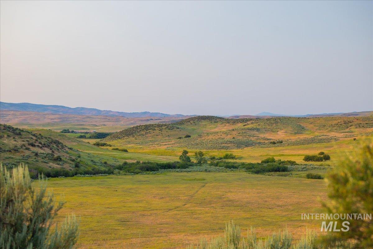 View of mountain backdrop featuring rural landscape