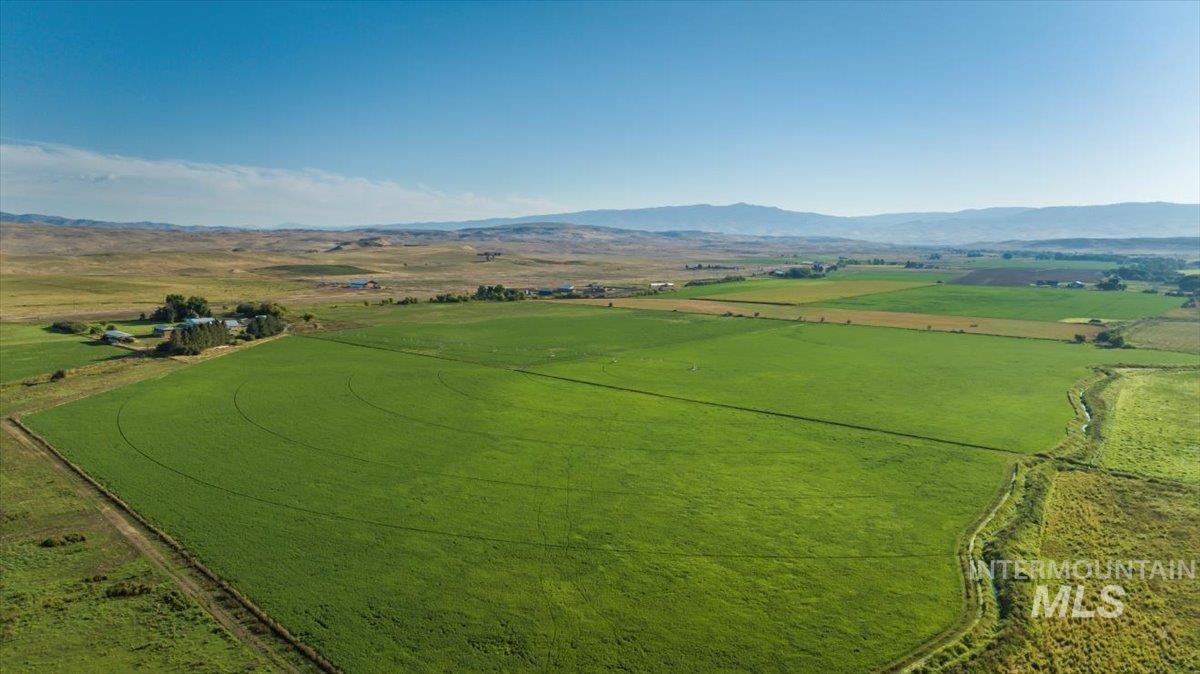 Overview of rural landscape featuring a mountainous background