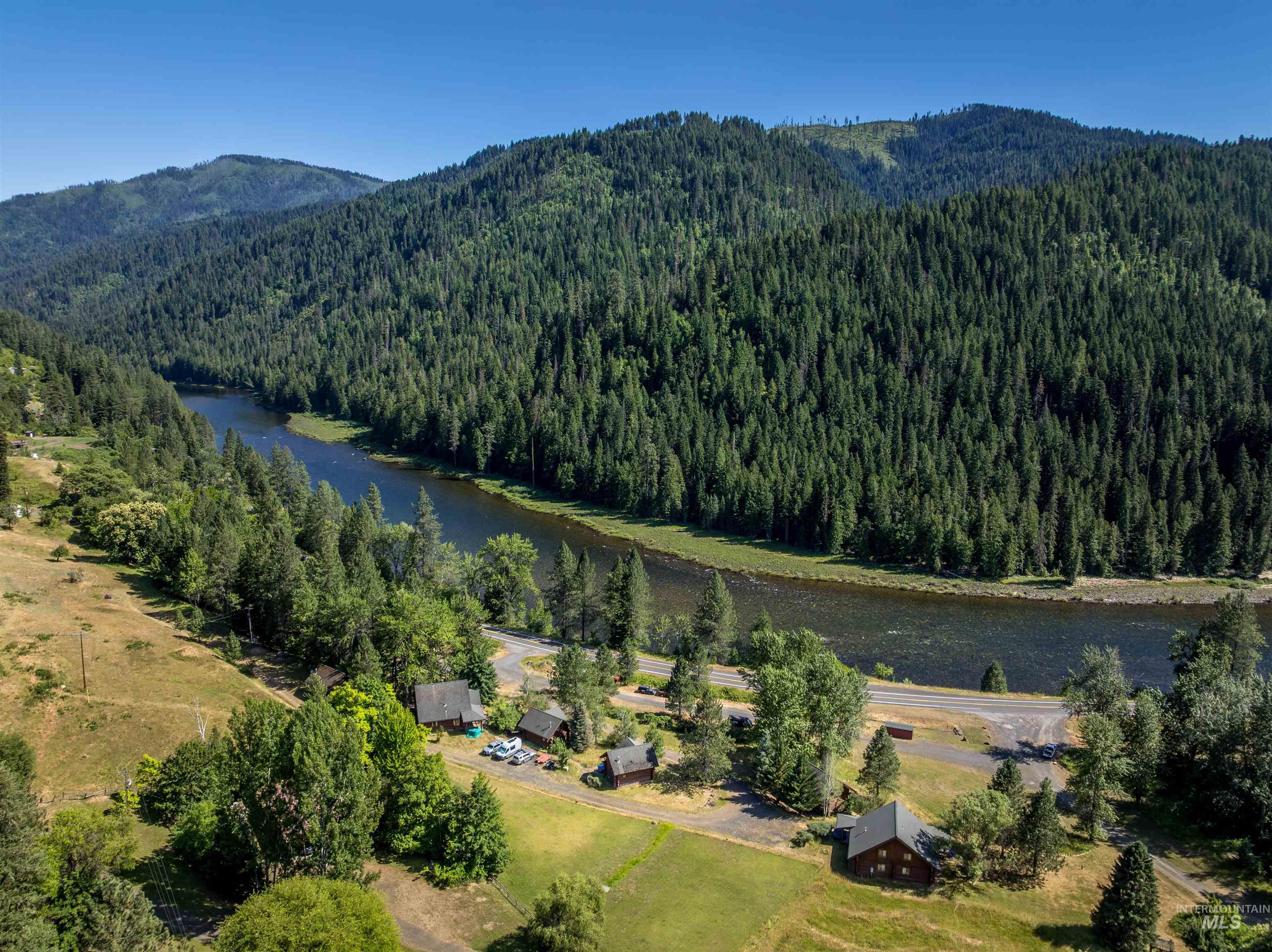 Drone / aerial view of property, the river and mountain views