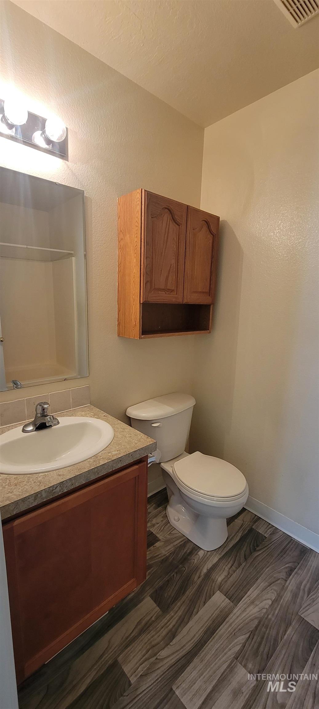 Bathroom featuring toilet and vanity