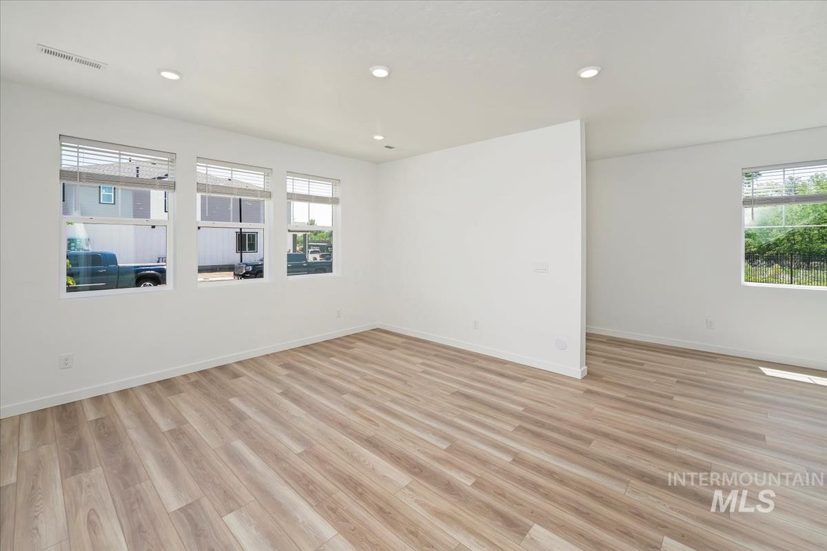 Unfurnished room featuring light wood-style flooring and recessed lighting
