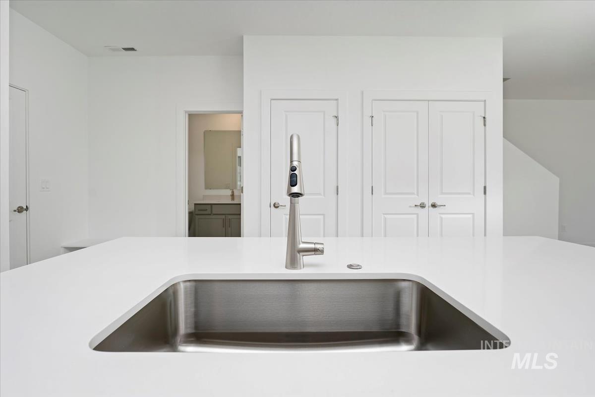 Kitchen view of light countertops