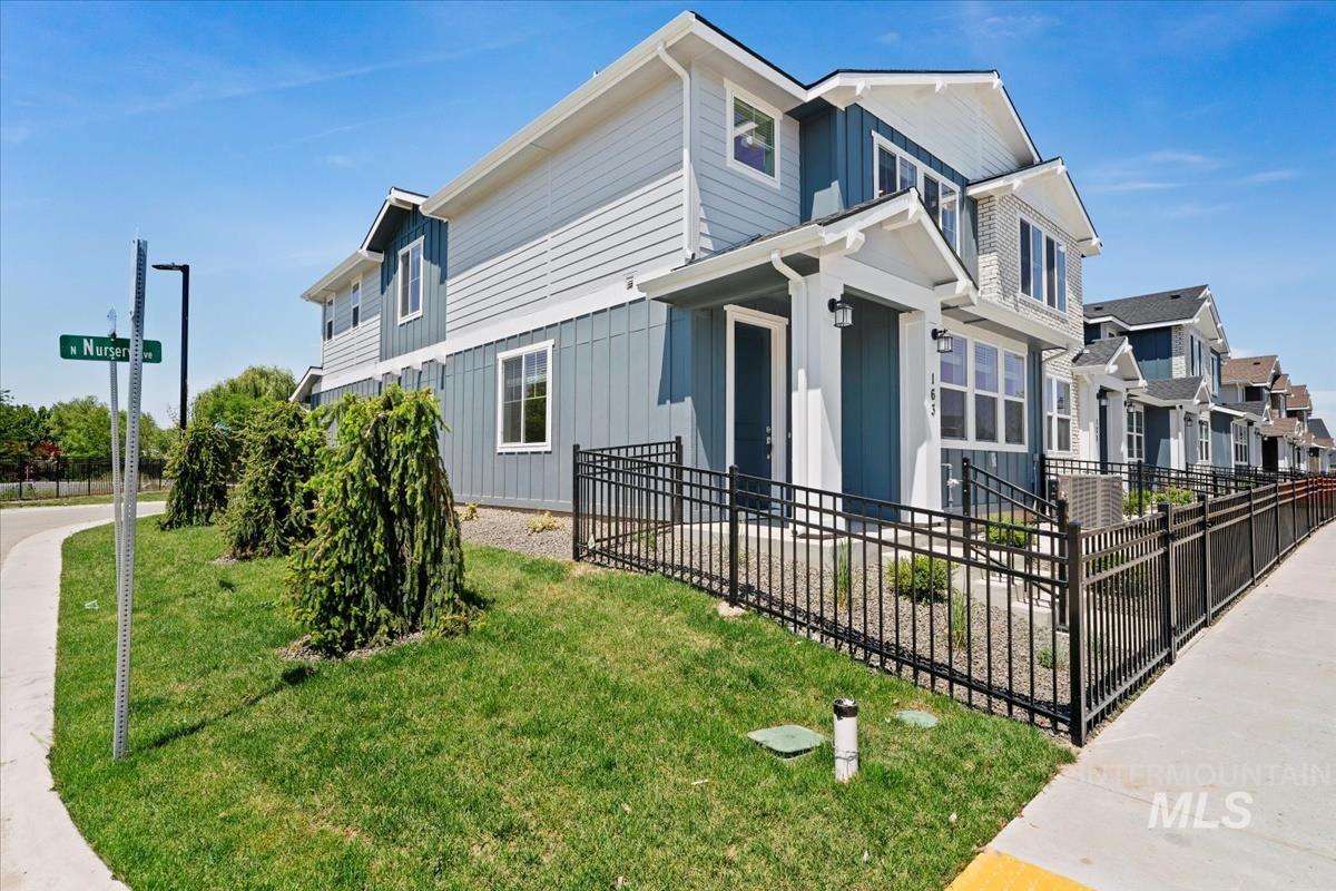 View of front facade featuring board and batten siding and a residential view