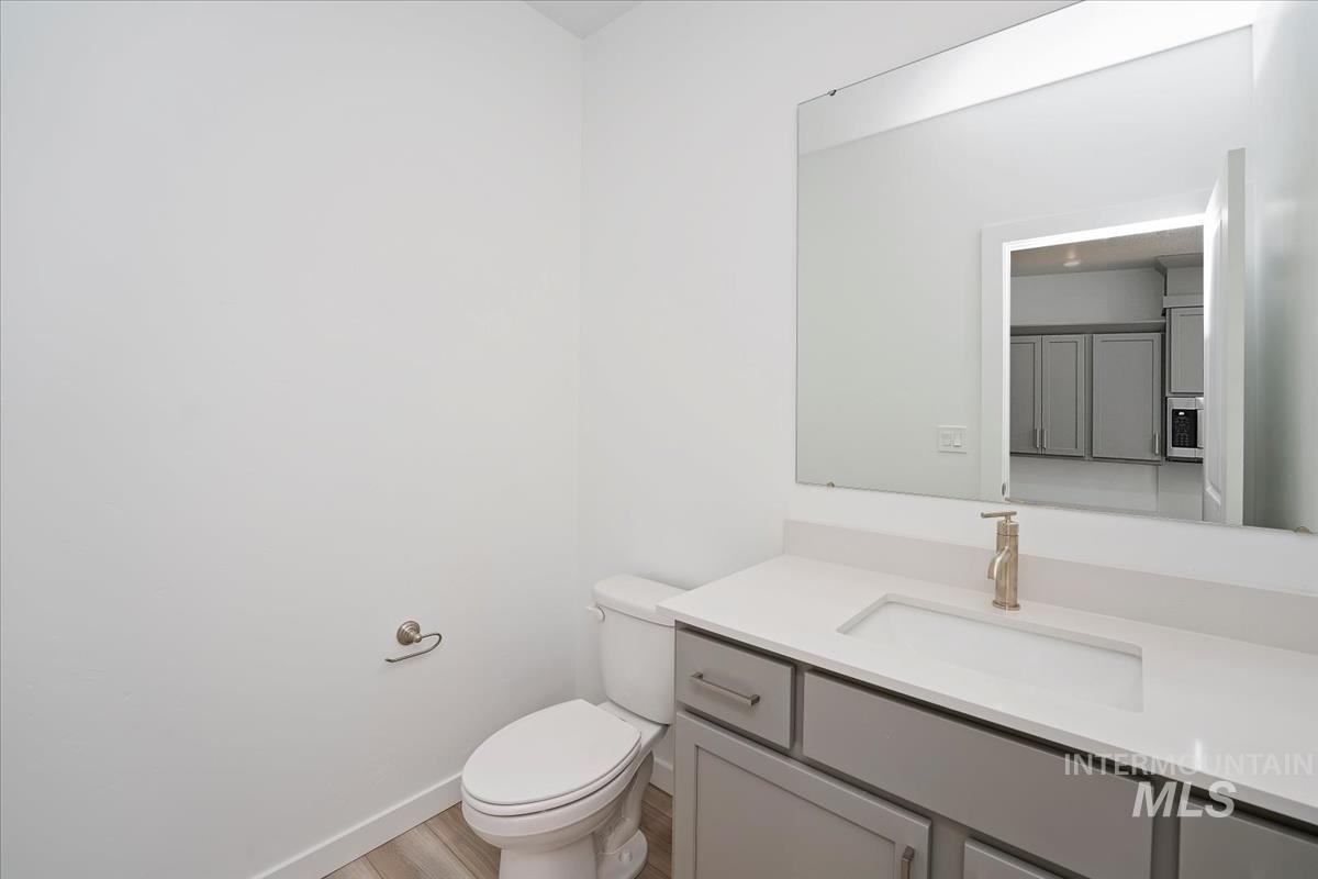 Bathroom featuring vanity and wood finished floors